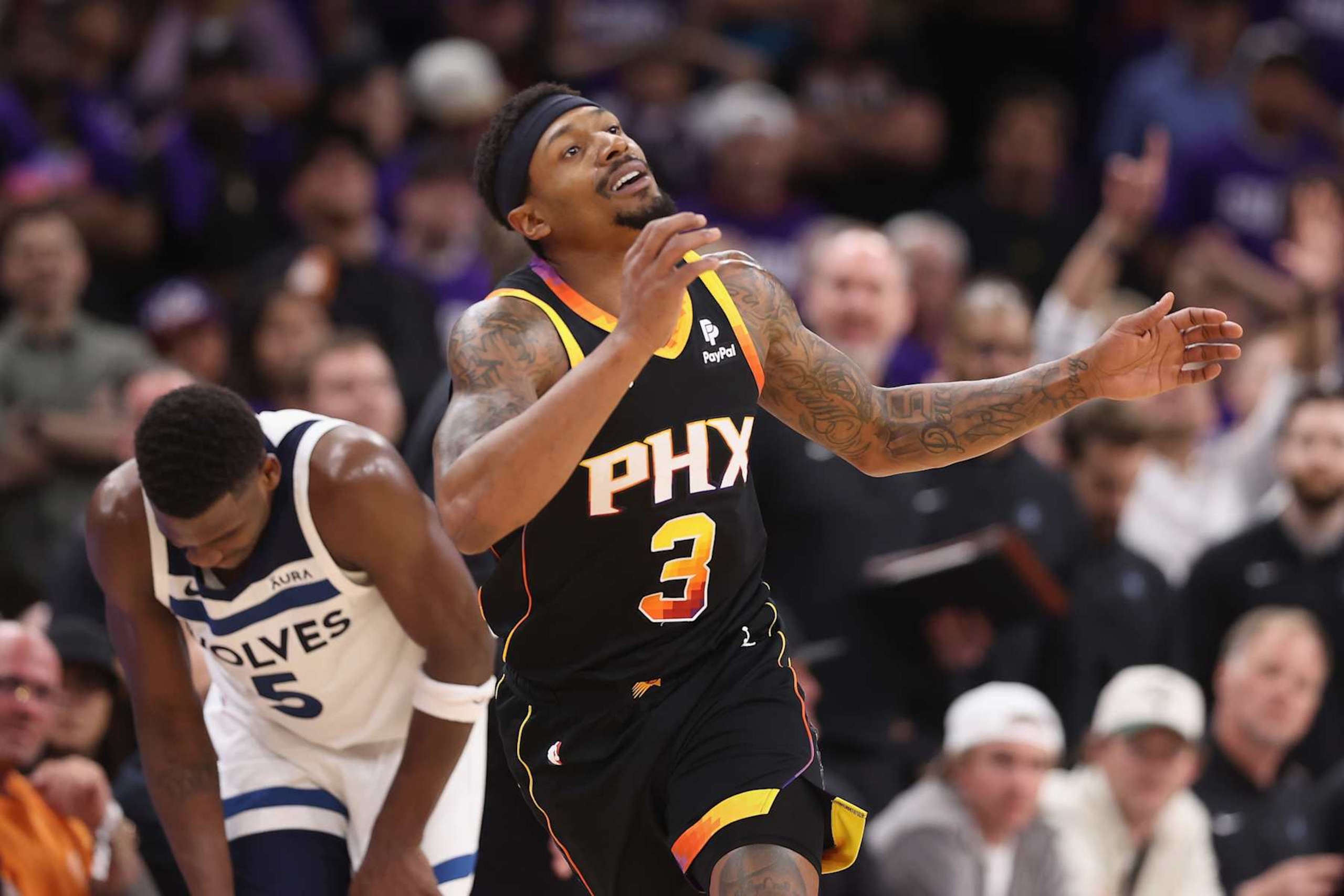PHOENIX, ARIZONA - APRIL 28: Bradley Beal #3 of the Phoenix Suns reacts after fouling out against Anthony Edwards #5 of the Minnesota Timberwolves during the second half of game four of the Western Conference First Round Playoffs at Footprint Center on April 28, 2024 in Phoenix, Arizona.The Timberwolves defeated the Suns 122-116 and win the series 4-0. NOTE TO USER: User expressly acknowledges and agrees that, by downloading and or using this photograph, User is consenting to the terms and conditions of the Getty Images License Agreement.  (Photo by Christian Petersen/Getty Images)