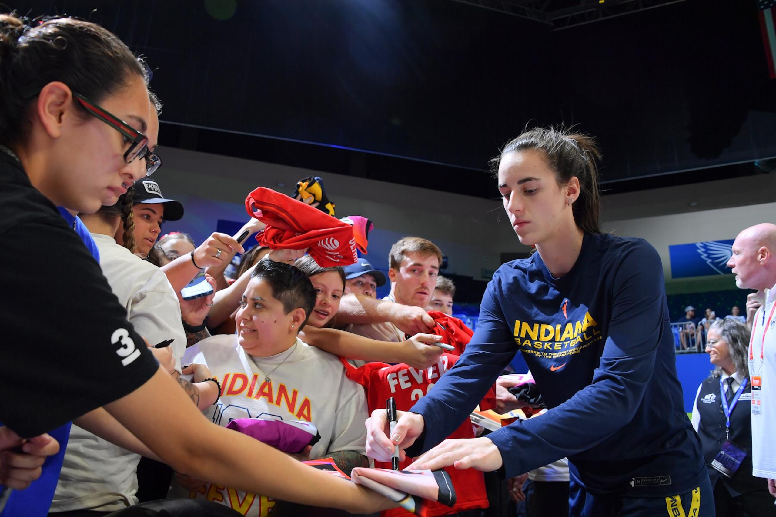 ARLINGTON, TX -  SEPTEMBER 1: Caitlin Clark #22 of the Indiana Fever signs fan gear before the game on September 1, 2024 at the College Park Center in Arlington, TX. NOTE TO USER: User expressly acknowledges and agrees that, by downloading and or using this photograph, User is consenting to the terms and conditions of the Getty Images License Agreement. Mandatory Copyright Notice: Copyright 2024 NBAE (Photo by Michael Gonzales/NBAE via Getty Images)