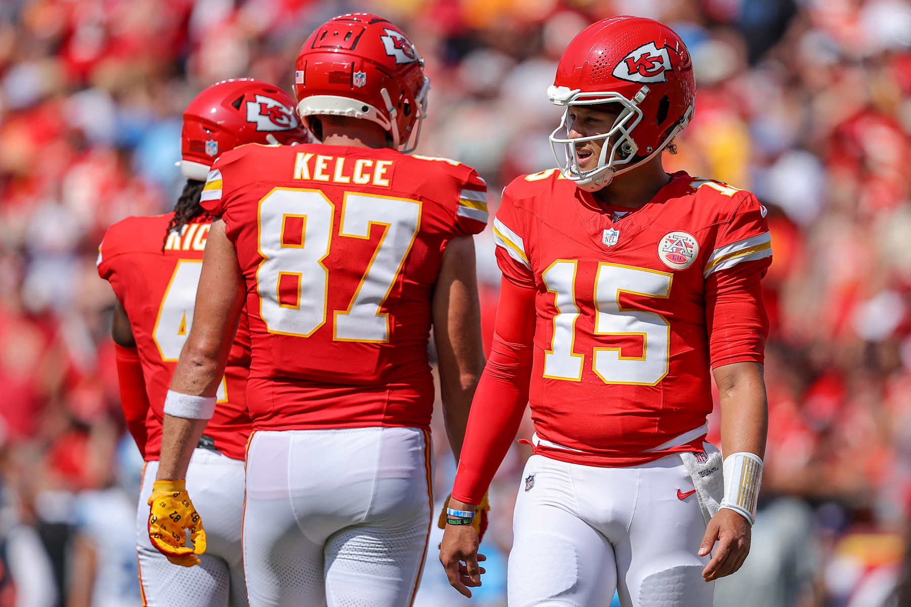 KANSAS CITY, MISSOURI - AUGUST 17: Patrick Mahomes #15 of the Kansas City Chiefs looks to the sidelines near Travis Kelce #87 of the Kansas City Chiefs during first quarter preseason game action against the Detroit Lions at GEHA Field at Arrowhead Stadium on August 17, 2024 in Kansas City, Missouri. (Photo by David Eulitt/Getty Images)