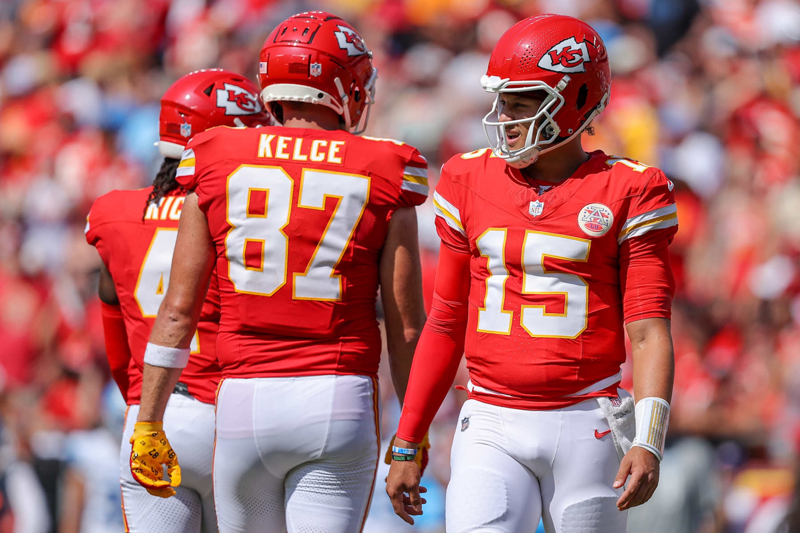 KANSAS CITY, MISSOURI - AUGUST 17: Patrick Mahomes #15 of the Kansas City Chiefs looks to the sidelines near Travis Kelce #87 of the Kansas City Chiefs during first quarter preseason game action against the Detroit Lions at GEHA Field at Arrowhead Stadium on August 17, 2024 in Kansas City, Missouri. (Photo by David Eulitt/Getty Images)
