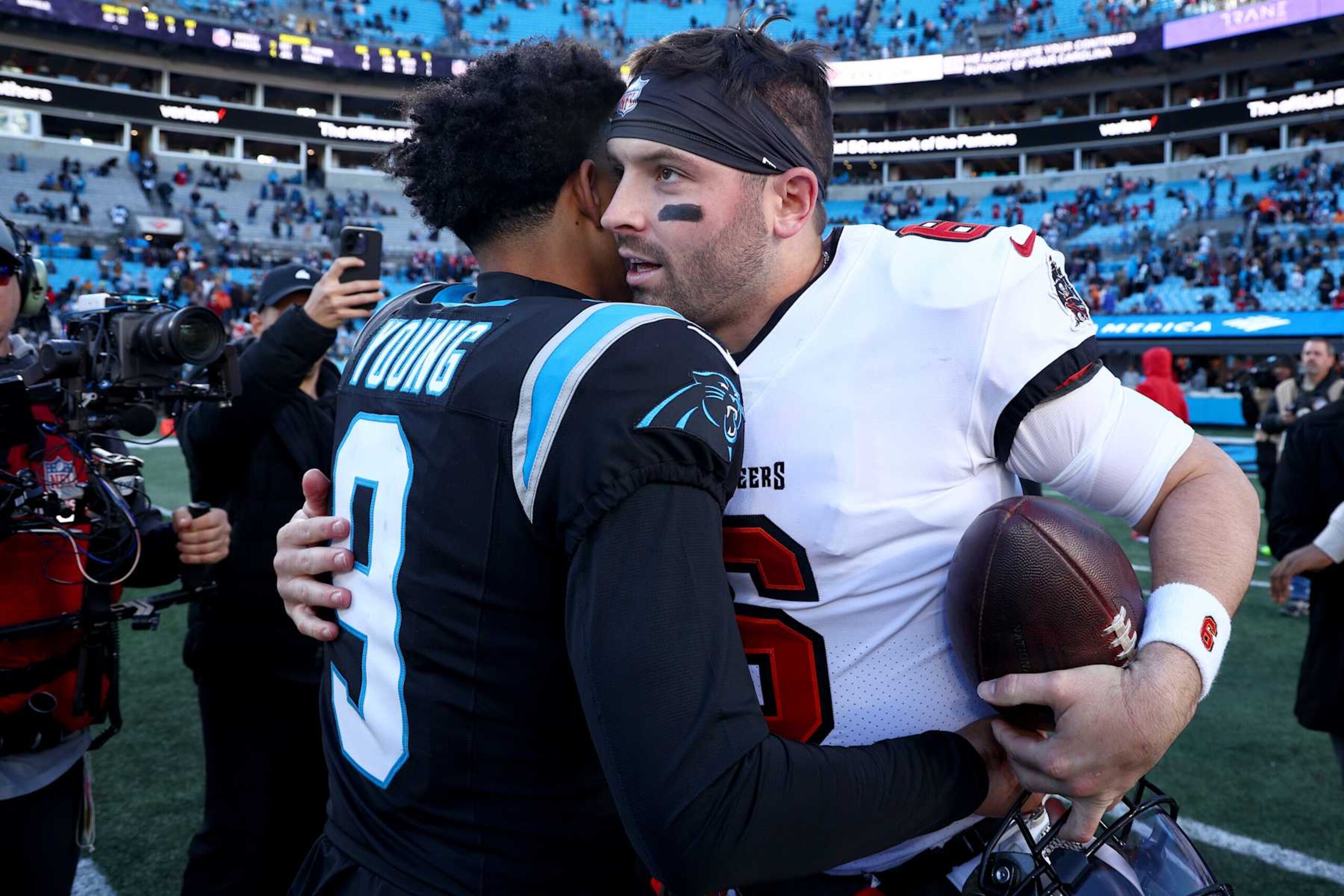 CHARLOTTE, NORTH CAROLINA - JANUARY 07: Bryce Young #9 of the Carolina Panthers and Baker Mayfield #6 of the Tampa Bay Buccaneers embrace after the game at Bank of America Stadium on January 07, 2024 in Charlotte, North Carolina. (Photo by Jared C. Tilton/Getty Images)