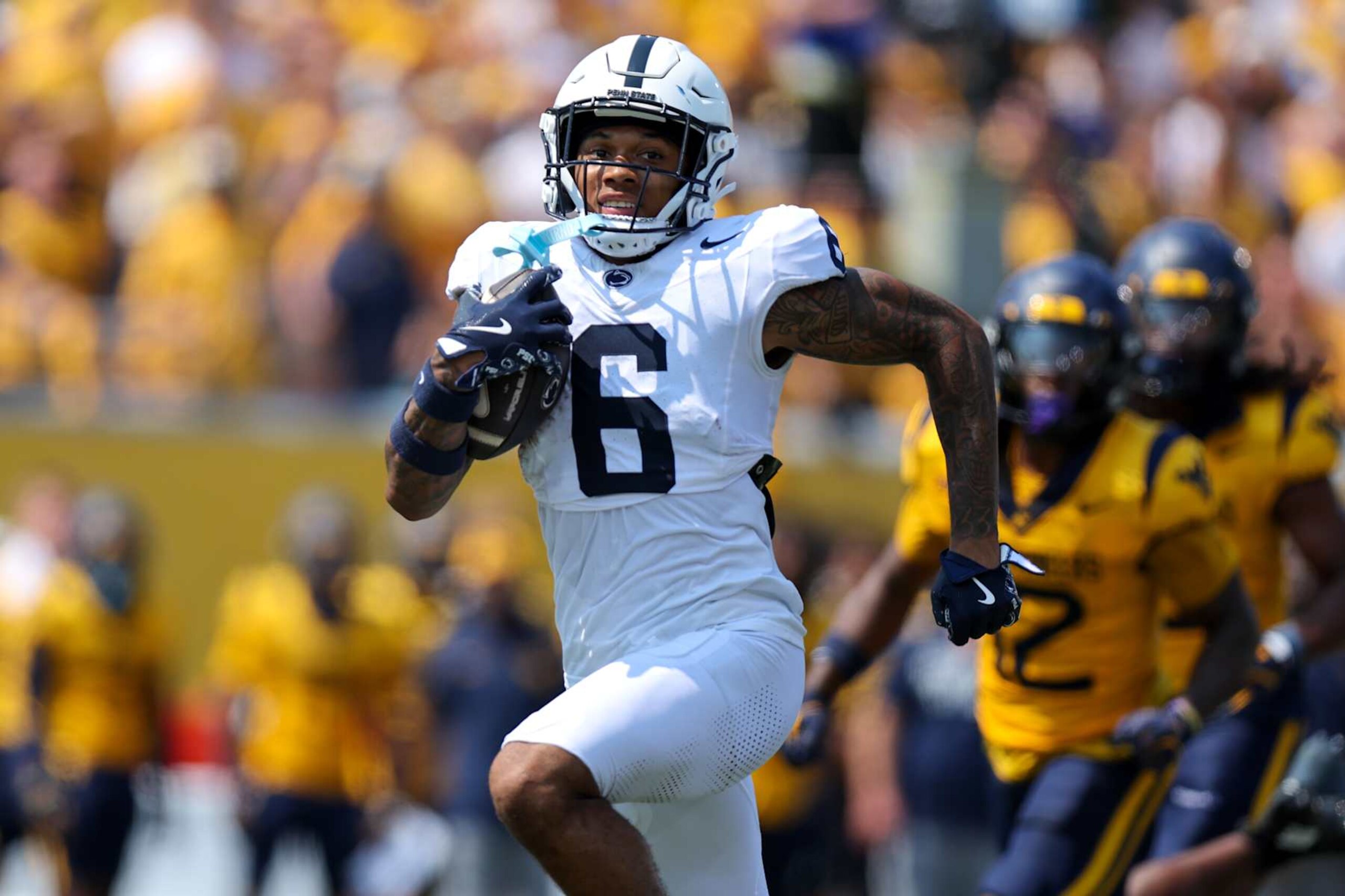 MORGANTOWN, WV - AUGUST 31: Penn State Nittany Lions wide receiver Harrison Wallace III (6) scores on a 50-yard touchdown pass during the second quarter of the college football game between the Penn State Nittany Lions and the West Virginia Mountaineers on August 31, 2024, at Mountaineer Field at Milan Puskar Stadium in Morgantown, WV. (Photo by Frank Jansky/Icon Sportswire via Getty Images)