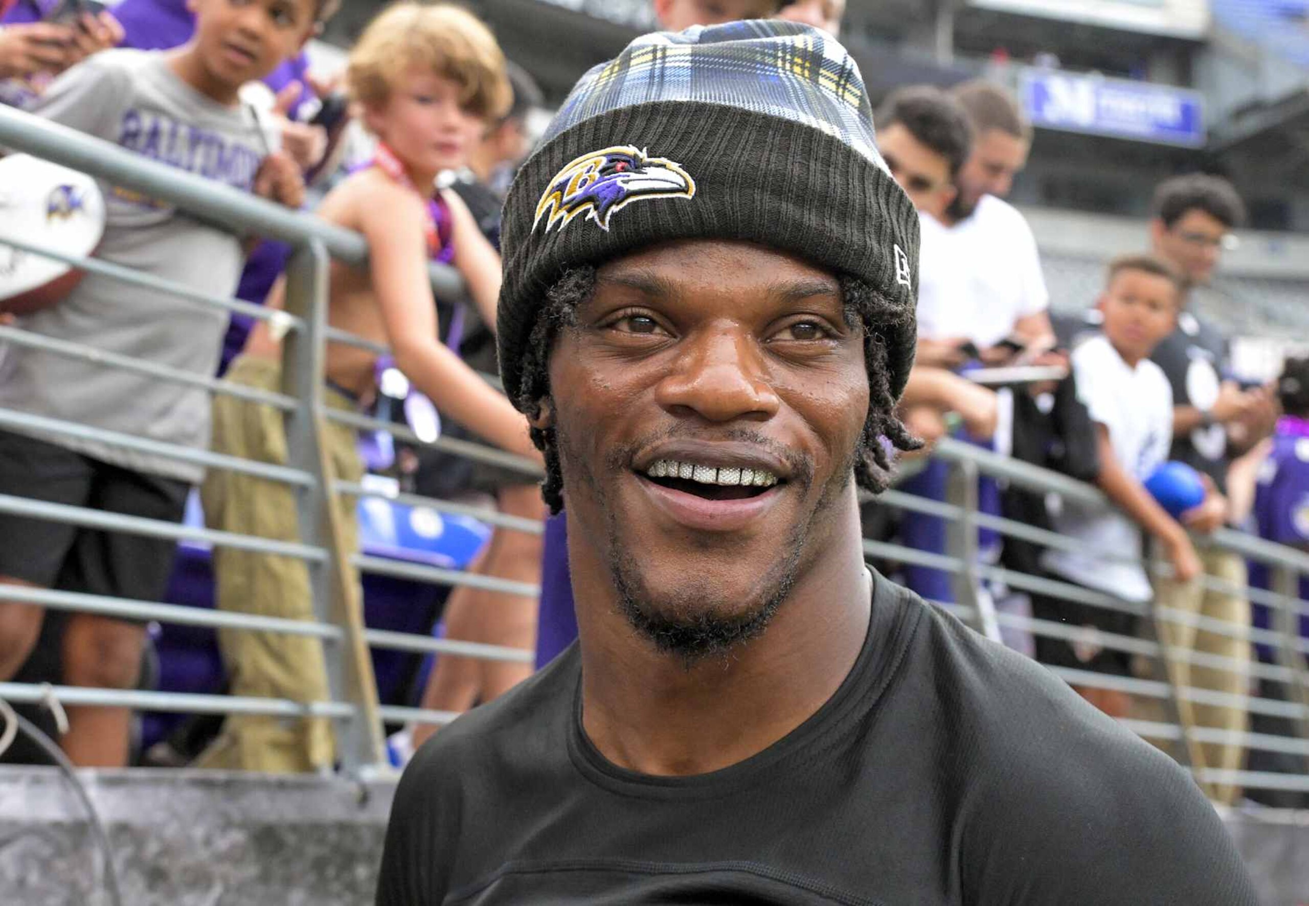 BALTIMORE, MD - AUGUST 9:  Baltimore Ravens quarterback Lamar Jackson (8) runs off the field after a selfie prior to the Philadelphia Eagles pre season game versus the Baltimore Ravens on August 9, 2024 at M&T Bank Stadium in Baltimore, MD.  (Photo by Mark Goldman/Icon Sportswire via Getty Images)