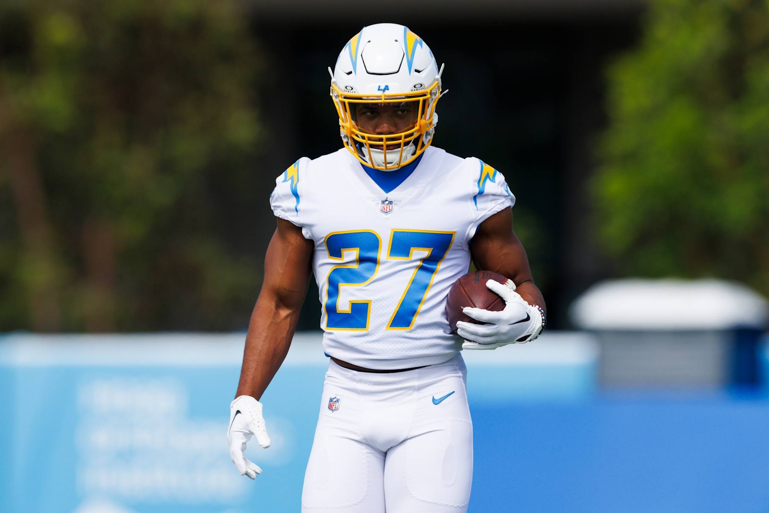 COSTA MESA, CALIFORNIA - JUNE 13: J.K. Dobbins #27 of the Los Angeles Chargers runs with the ball during an NFL football practice at Hoag Performance Center on June 13, 2024 in Costa Mesa, California. (Photo by Ric Tapia/Getty Images)