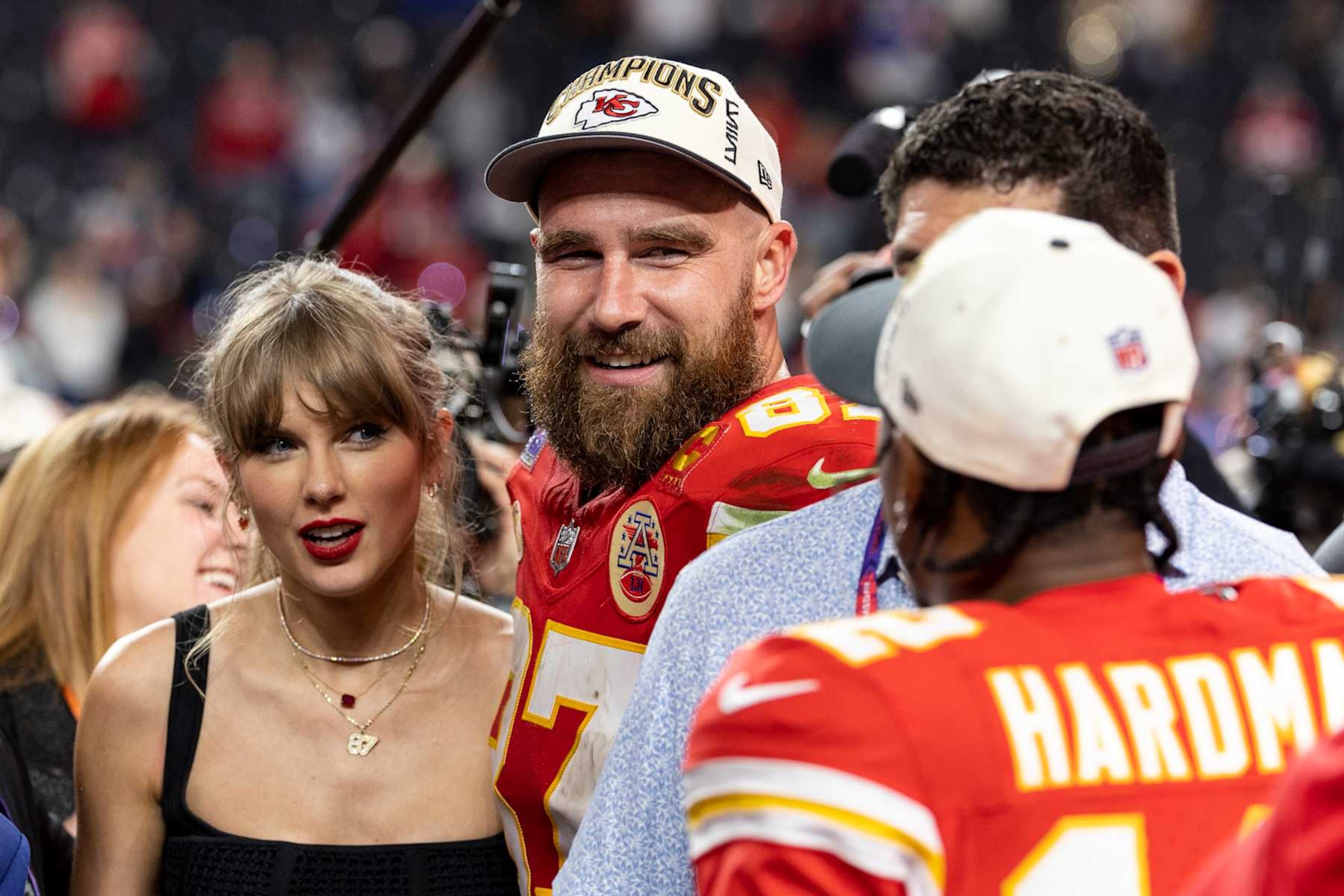 LAS VEGAS, NEVADA - FEBRUARY 11: Travis Kelce #87 of the Kansas City Chiefs and Taylor Swift react as they see Mecole Hardman Jr. #12 of the Kansas City Chiefs following the NFL Super Bowl 58 football game between the San Francisco 49ers and the Kansas City Chiefs at Allegiant Stadium on February 11, 2024 in Las Vegas, Nevada. (Photo by Michael Owens/Getty Images)