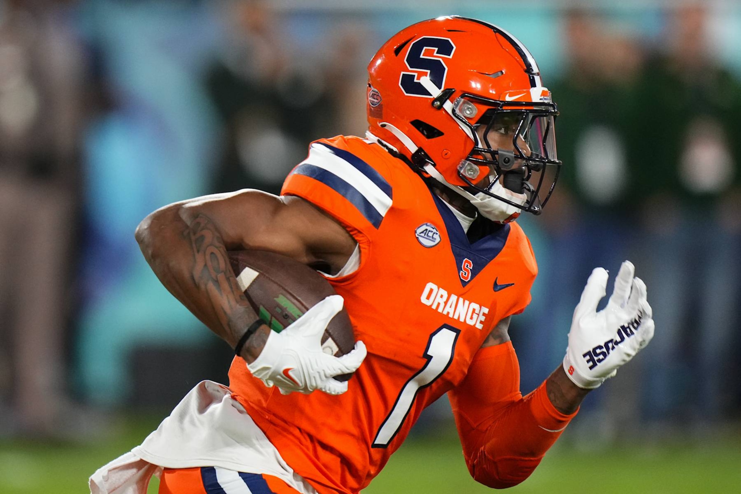 BOCA RATON, FLORIDA - DECEMBER 21: LeQuint Allen #1 of the Syracuse Orange runs the ball against the South Florida Bulls during the first quarter in the RoofClaim.com Boca Raton Bowl game at FAU Stadium on December 21, 2023 in Boca Raton, Florida. (Photo by Rich Storry/Getty Images)