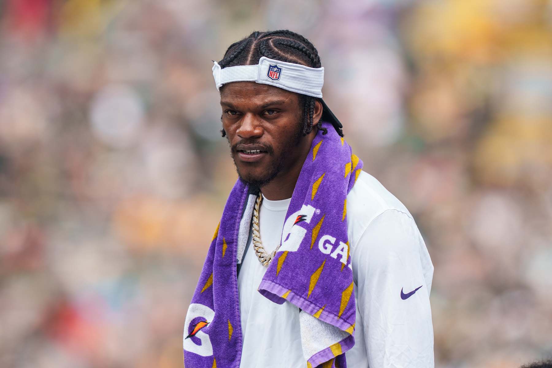 GREEN BAY, WI - AUGUST 24: Quarterback Lamar Jackson #9 of the Baltimore Ravens on the sidelines during the third quarter of an NFL preseason football game against the Green Bay Packers at Lambeau Field on August 24, 2024 in Green Bay, Wisconsin. (Photo by Todd Rosenberg/Getty Images)