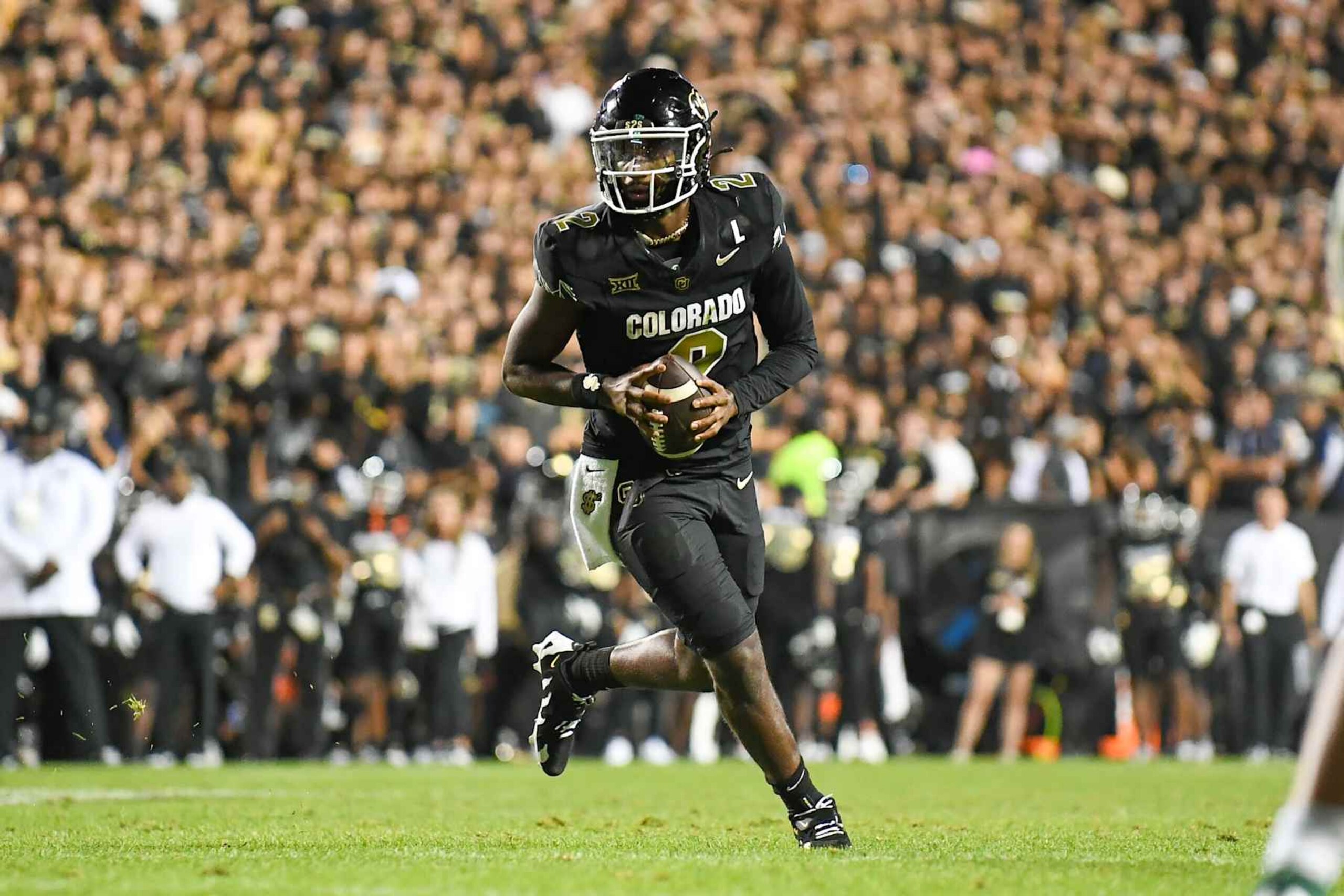 BOULDER, CO - AUGUST 29: Colorado quarterback Shedeur Sanders (2) scrambles out of the pocket looking for a receiver during the college football game between the North Dakota State Bison and the Colorado Buffaloes on August 29, 2024 at Folsom Field in Boulder, CO. (Photo by Kevin Langley/Icon Sportswire via Getty Images)