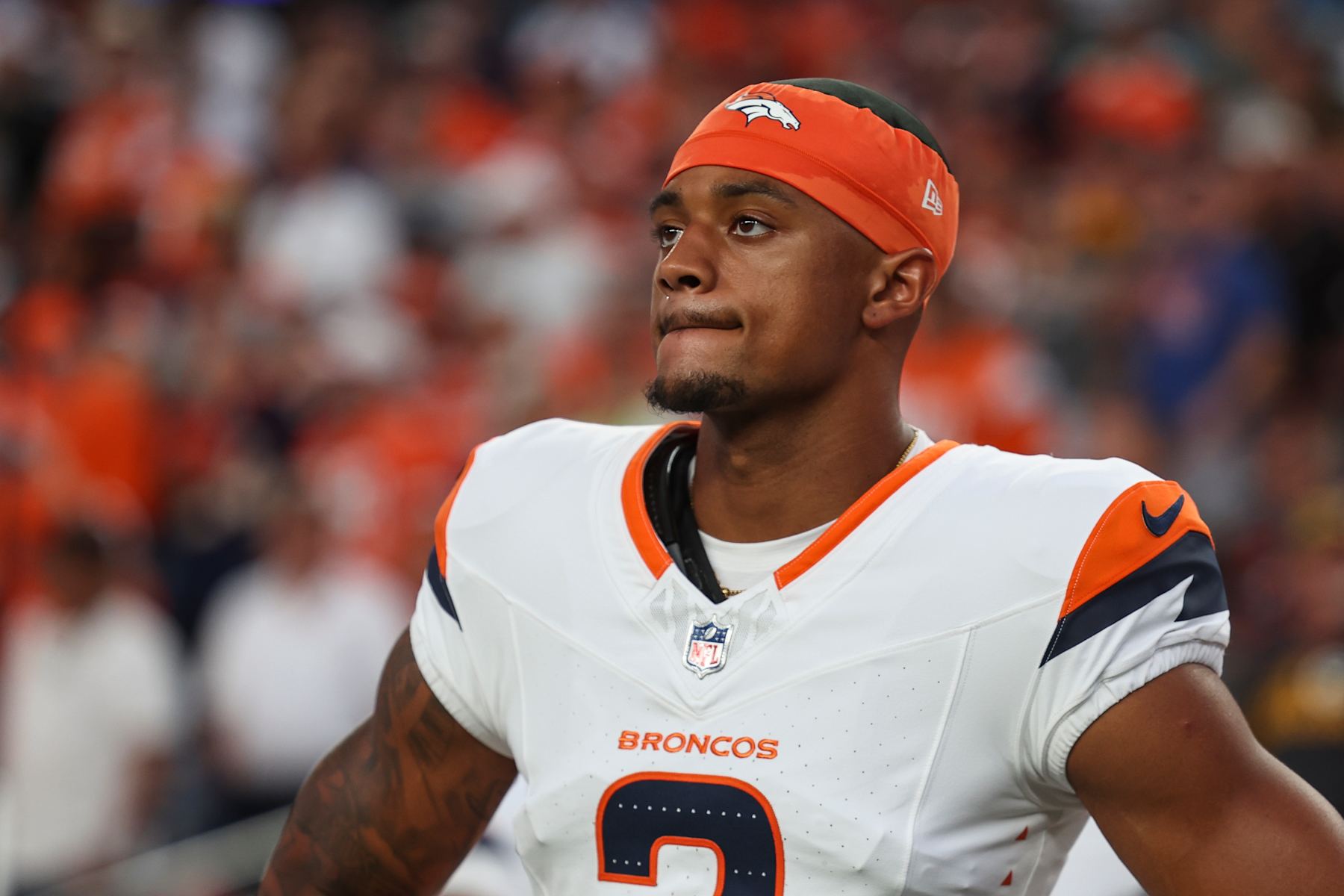 DENVER, CO - AUGUST 18: Pat Surtain II #2 of the Denver Broncos looks on from the sideline during the national anthem prior to an NFL football game against the Green Bay Packers at Empower Field at Mile High on August 18, 2024 in Denver, CO. (Photo by Perry Knotts/Getty Images)
