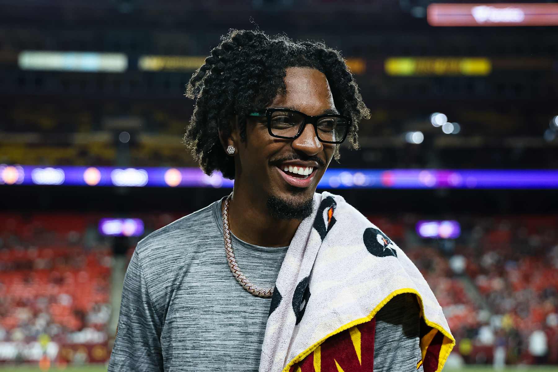 LANDOVER, MD - AUGUST 25: Jayden Daniels #5 of the Washington Commanders reacts on the sideline during the fourth quarter of the preseason game against the New England Patriots at Commanders Field on August 25, 2024 in Landover, Maryland. (Photo by Scott Taetsch/Getty Images)