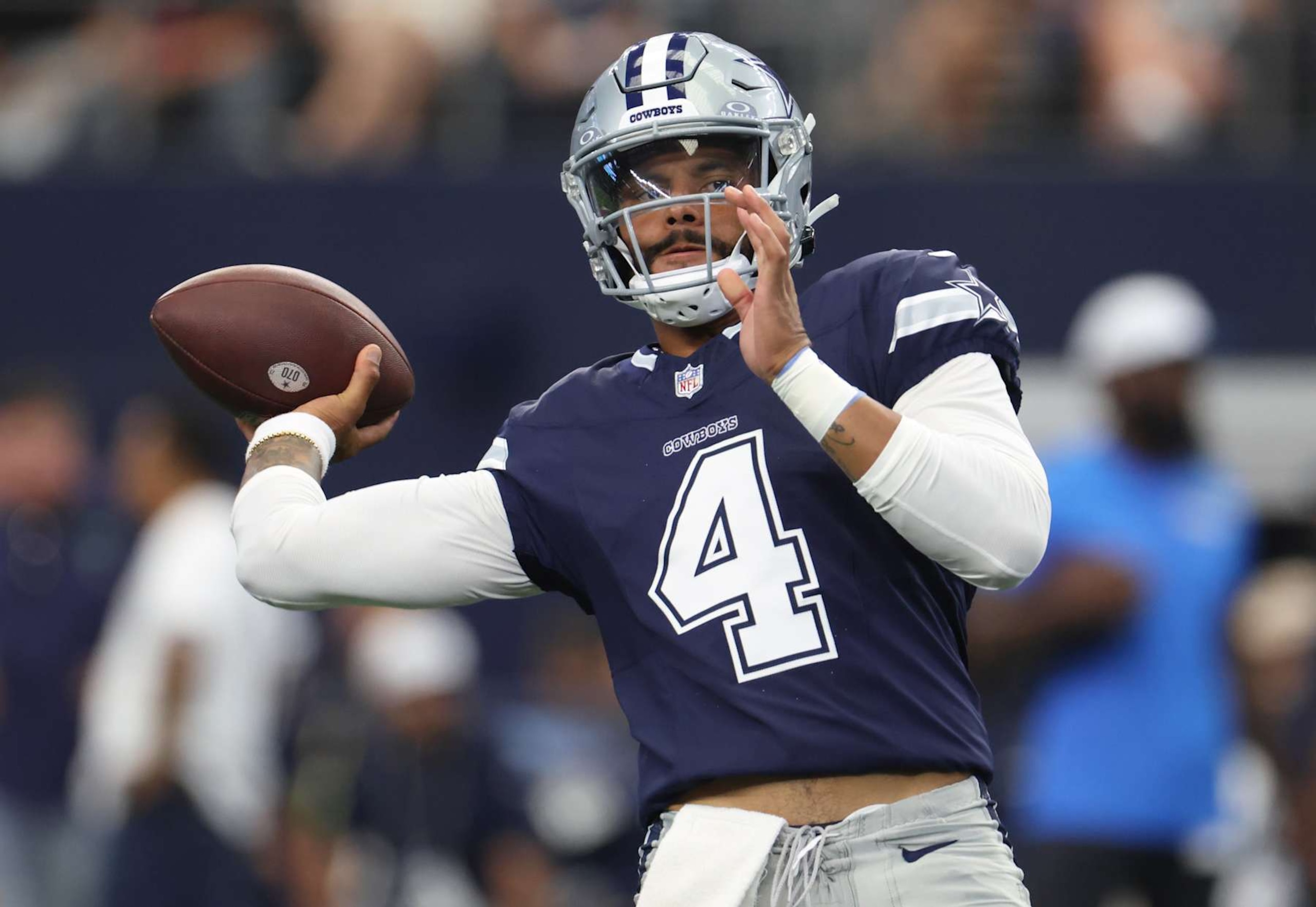 ARLINGTON, TX - AUGUST 24: Dak Prescott #4 of the Dallas Cowboys warms up before a preseason game between the Dallas Cowboys and the Los Angeles Chargers at AT&T Stadium on August 24, 2024 in Arlington, Texas. (Photo by Ron Jenkins/Getty Images) ARLINGTON, TX - AUGUST 24: Dak Prescott #4 of the Dallas Cowboys warms up before a preseason game between the Dallas Cowboys and the Los Angeles Chargers at AT&T Stadium on August 24, 2024 in Arlington, Texas. (Photo by Ron Jenkins/Getty Images)