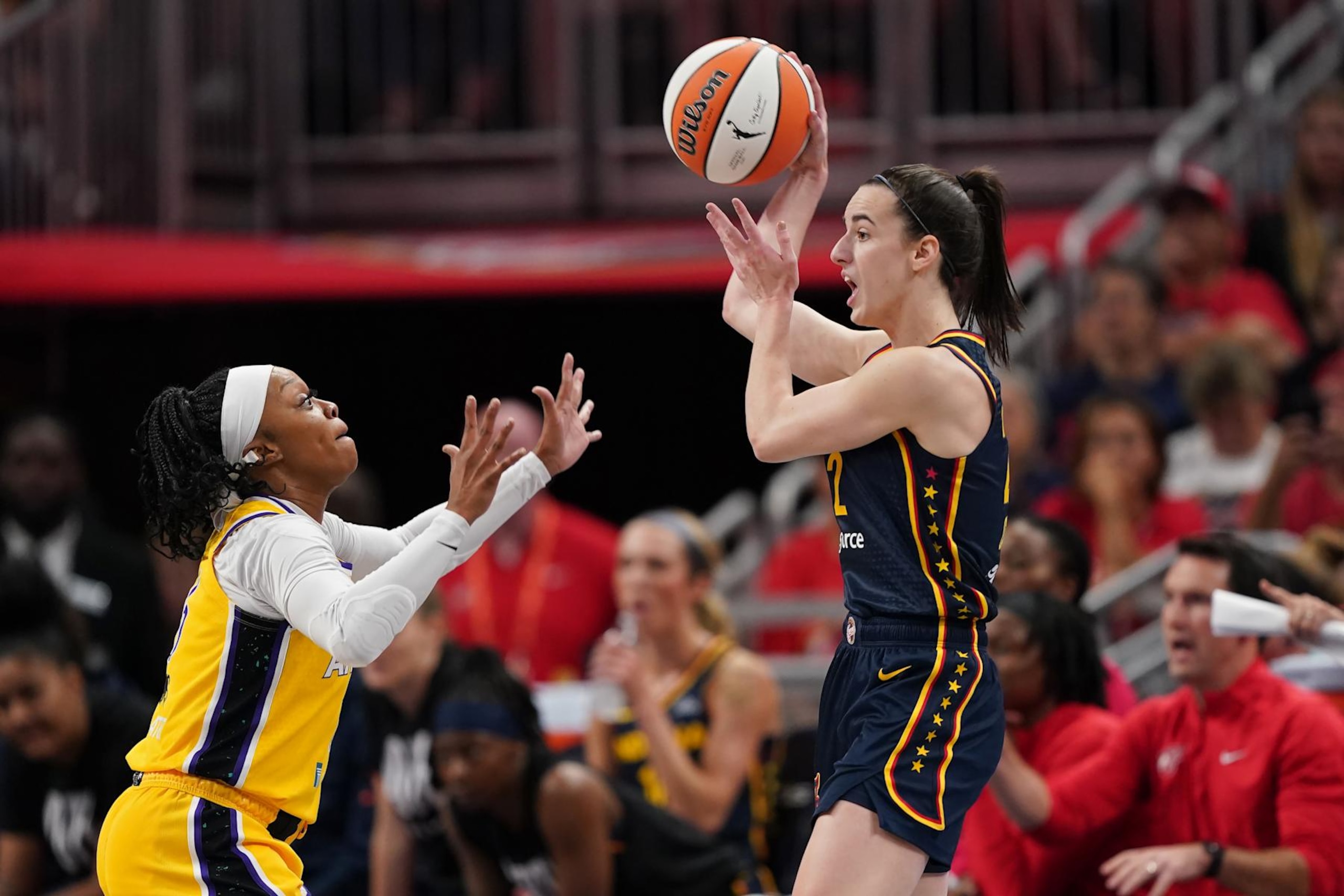 INDIANAPOLIS, INDIANA - SEPTEMBER 04: Caitlin Clark #22 of the Indiana Fever passes the ball against Odyssey Sims #6 of the Los Angeles Sparks in the first quarter at Gainbridge Fieldhouse on September 04, 2024 in Indianapolis, Indiana. NOTE TO USER: User expressly acknowledges and agrees that, by downloading and or using this photograph, User is consenting to the terms and conditions of the Getty Images License Agreement. (Photo by Dylan Buell/Getty Images)