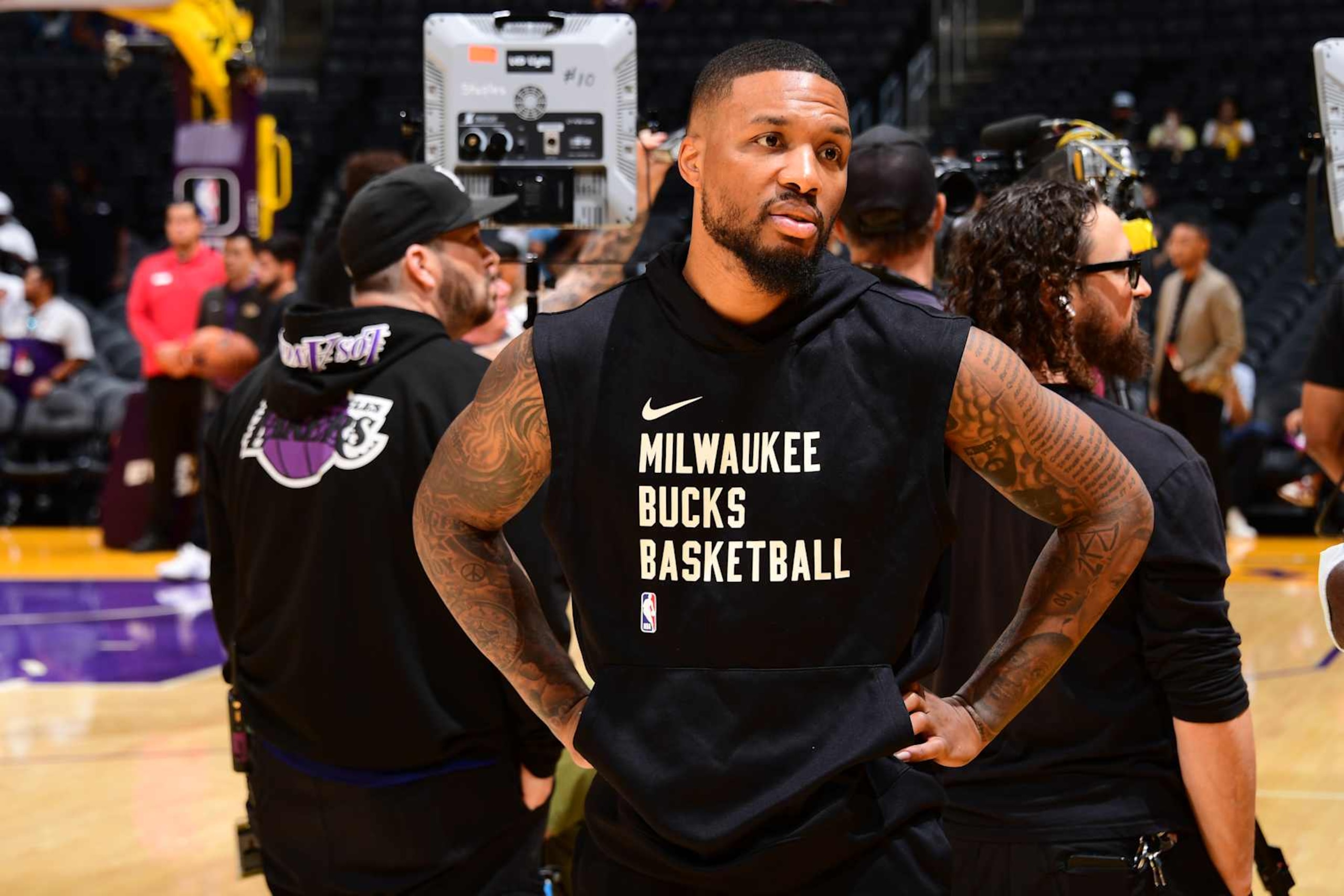 LOS ANGELES, CA - OCTOBER 15: Damian Lillard #0 of the Milwaukee Bucks looks on before the game against the Los Angeles Lakers dame and Chris Hayes  on October 15, 2023 at Crypto.Com Arena in Los Angeles, California. NOTE TO USER: User expressly acknowledges and agrees that, by downloading and/or using this Photograph, user is consenting to the terms and conditions of the Getty Images License Agreement. Mandatory Copyright Notice: Copyright 2023 NBAE (Photo by Adam Pantozzi/NBAE via Getty Images)