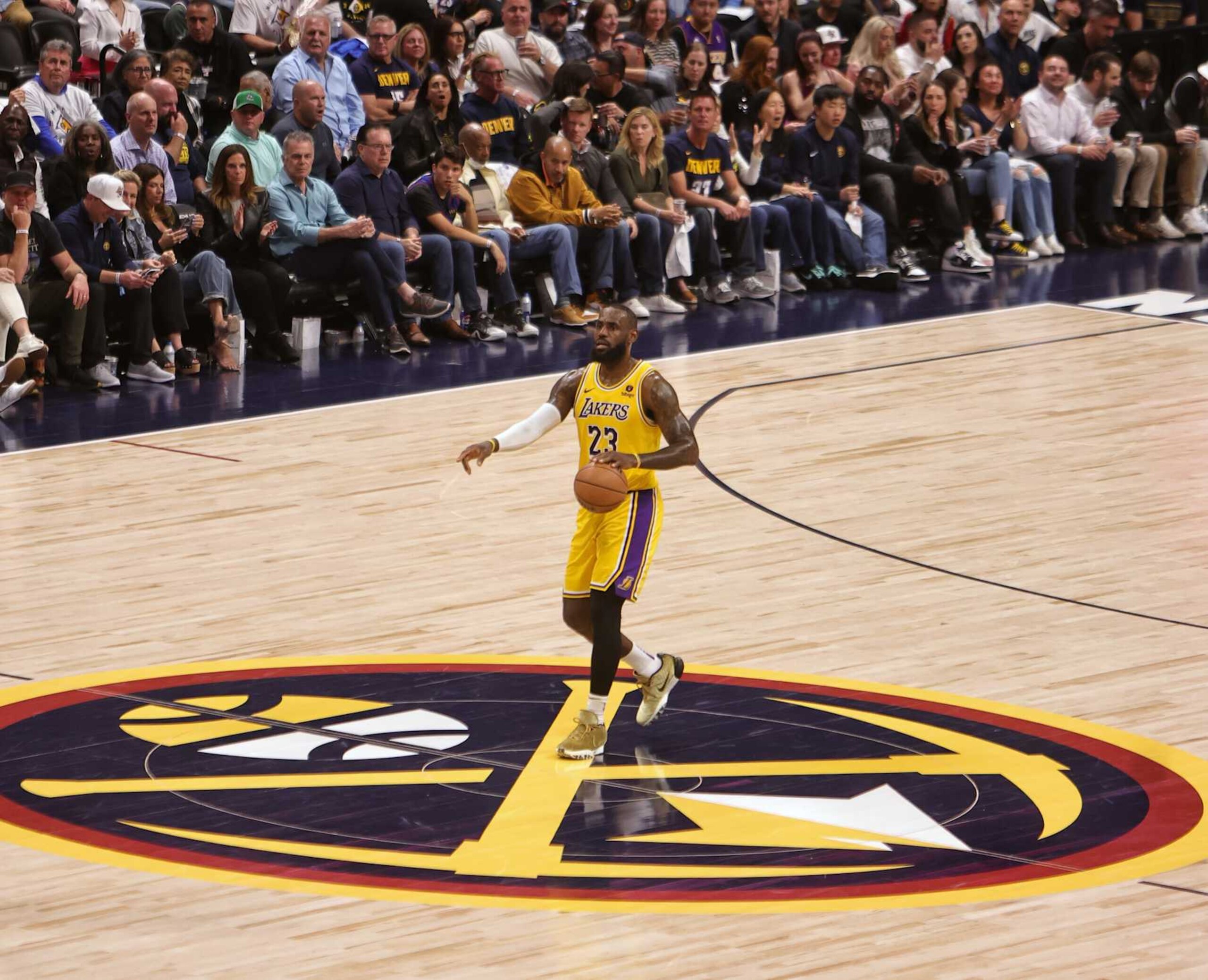 DENVER, CO - APRIL 29: LeBron James #23 of the Los Angeles Lakers brings the ball up court during the game against the Denver Nuggets during Round 1 Game 5 on April 29, 2024 at Ball Arena in Denver, Colorado. NOTE TO USER: User expressly acknowledges and agrees that, by downloading and/or using this Photograph, user is consenting to the terms and conditions of the Getty Images License Agreement. Mandatory Copyright Notice: Copyright 2024 NBAE (Photo by Jim Poorten/NBAE via Getty Images)