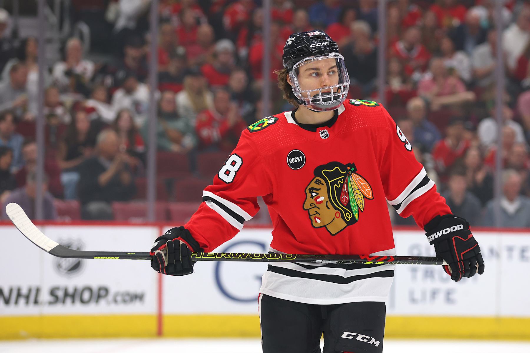 CHICAGO, ILLINOIS - APRIL 14: Connor Bedard #98 of the Chicago Blackhawks looks on against the Carolina Hurricanes during the first period at the United Center on April 14, 2024 in Chicago, Illinois. (Photo by Michael Reaves/Getty Images)