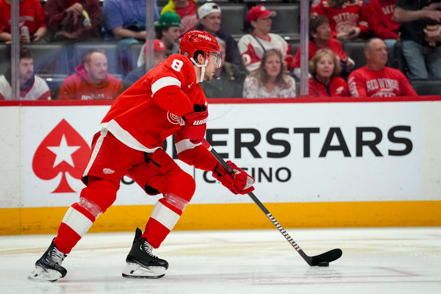 DETROIT, MICHIGAN - APRIL 09: Ben Chiarot #8 of the Detroit Red Wings handles the puck against the Washington Capitals at Little Caesars Arena on April 09, 2024 in Detroit, Michigan. (Photo by Nic Antaya/Getty Images)