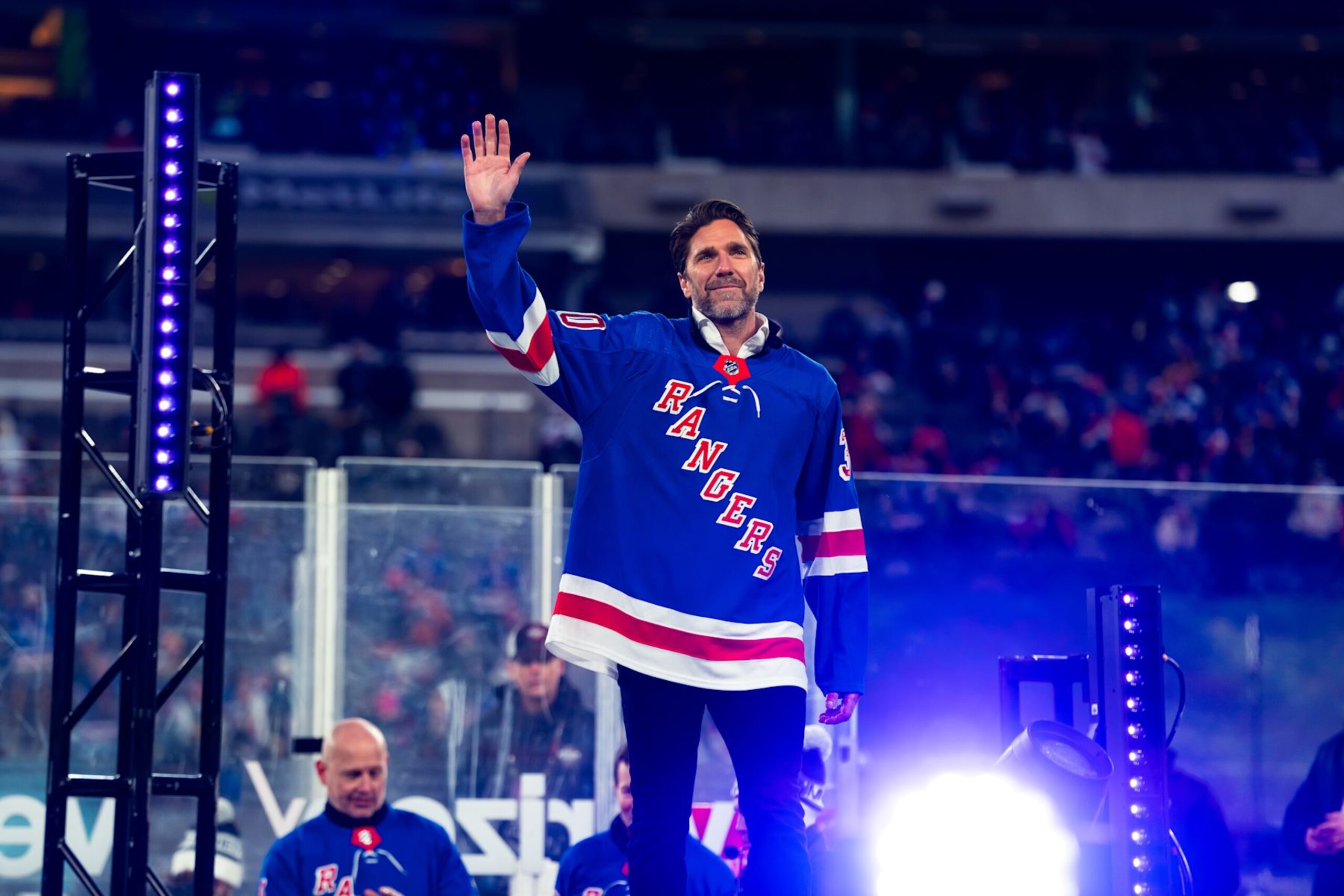 EAST RUTHERFORD, NEW JERSEY - FEBRUARY 18: Former New York Rangers player Henrik Lundqvist salutes the crowd during the second intermission of the game at MetLife Stadium on February 18, 2024 in East Rutherford, New Jersey. (Photo by Dennis DaSilva/NHLI via Getty Images) EAST RUTHERFORD, NEW JERSEY - FEBRUARY 18: Former New York Rangers player Henrik Lundqvist salutes the crowd during the second intermission of the game at MetLife Stadium on February 18, 2024 in East Rutherford, New Jersey. (Photo by Dennis DaSilva/NHLI via Getty Images)