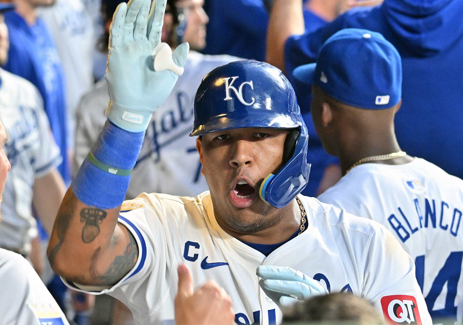 KANSAS CITY, MO - AUG 10: Kansas City Royals first baseman Salvador Perez (13) celebrates as he is congratulated by teammates after scoring during an MLB game  between the St. Louis Cardinals and the Kansas City Royals on August 10, 2024, at Kauffman Stadium, Kansas City, MO..  (Photo by Keith Gillett/Icon Sportswire via Getty Images)