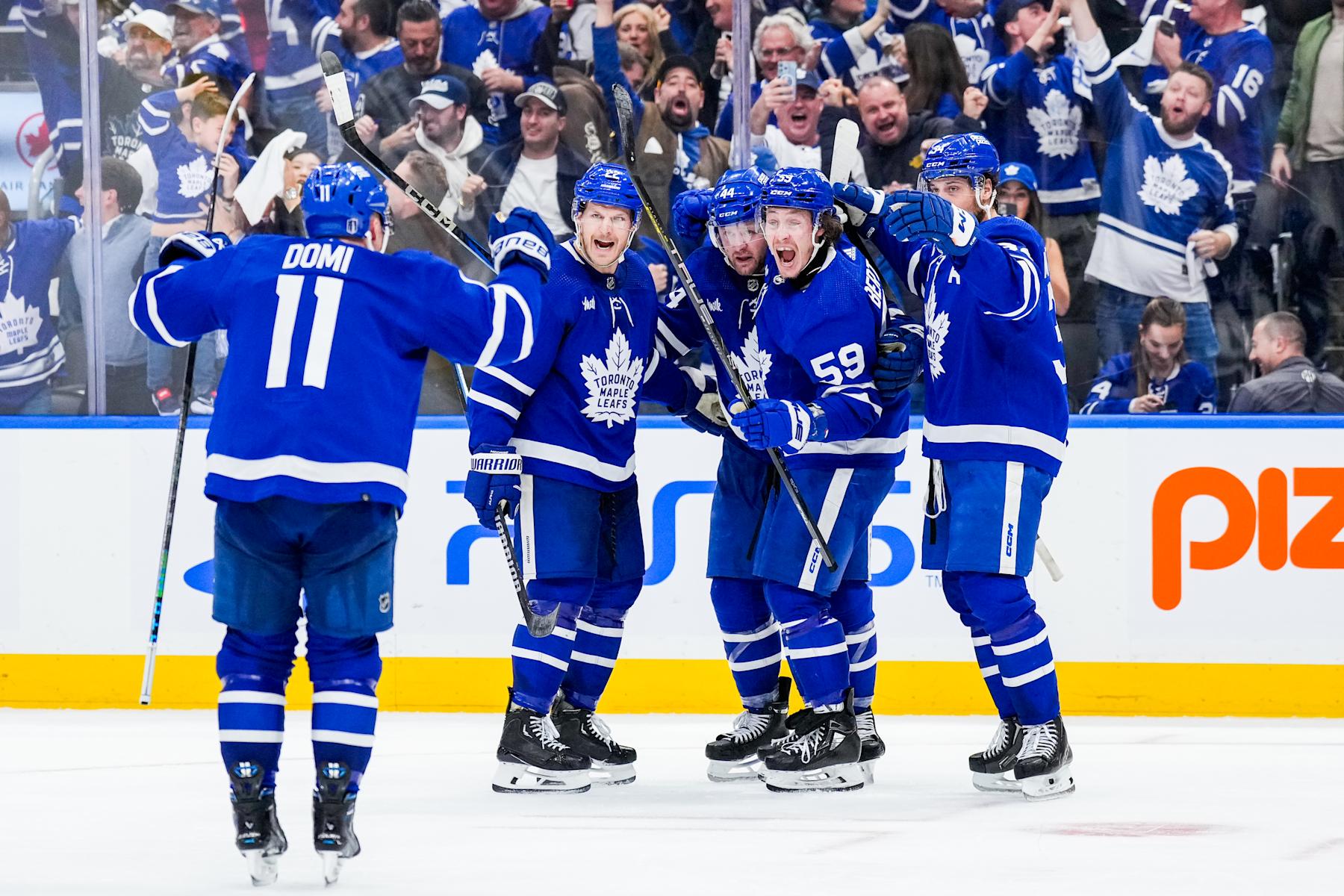 TORONTO, ON - APRIL 24: Tyler Bertuzzi #59 of the Toronto Maple Leafs celebrates his goal against the Boston Bruins with teammates Max Domi #11, Jake McCabe #22, Morgan Rielly #44 and Auston Matthews #34 during the third period in Game Three of the First Round of the 2024 Stanley Cup Playoffs at Scotiabank Arena on April 24, 2024 in Toronto, Ontario, Canada. (Photo by Kevin Sousa/NHLI via Getty Images)