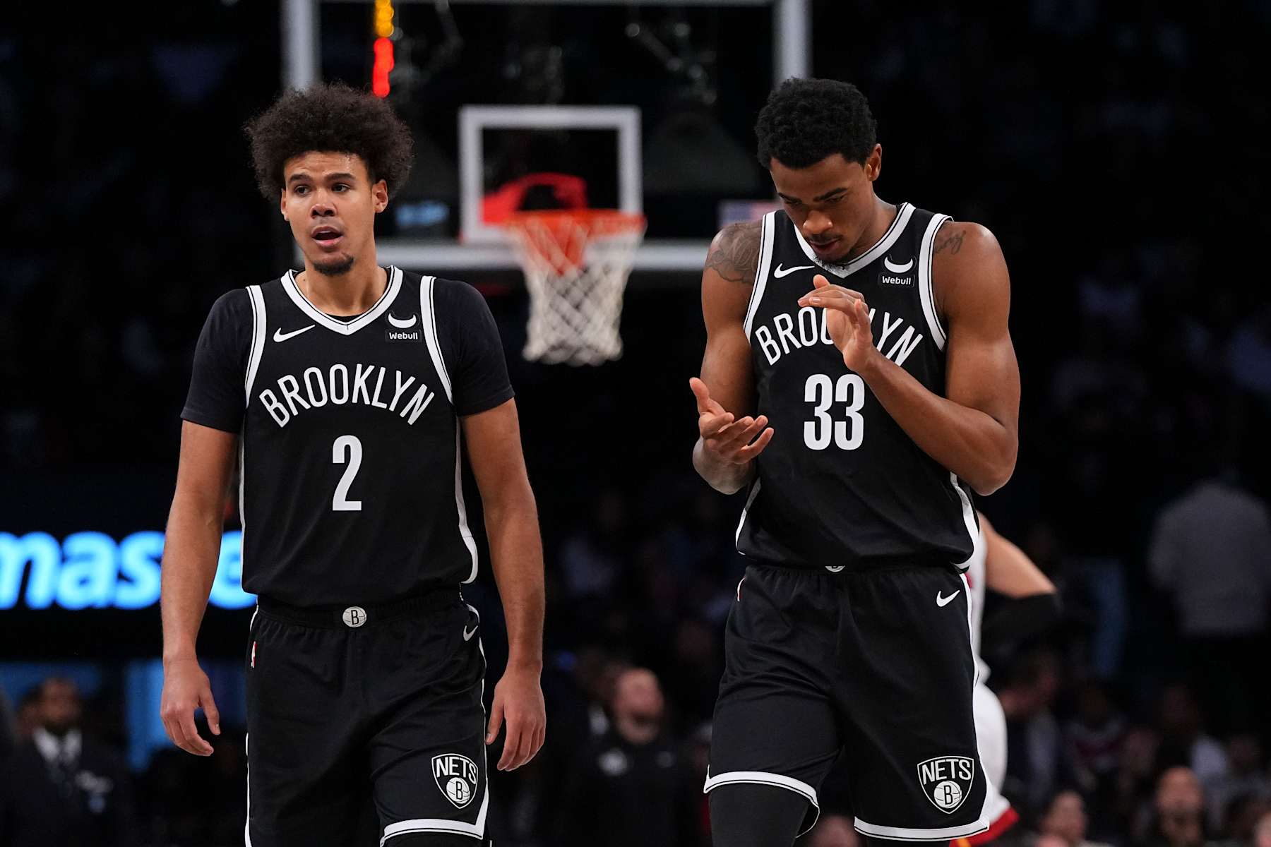 NEW YORK, NEW YORK - NOVEMBER 25: Cameron Johnson #2 and Nic Claxton #33 of the Brooklyn Nets look on Miami Heat at Barclays Center on November 25, 2023 in the Brooklyn borough of New York City. The Nets defeated the Heat 112-97. NOTE TO USER: User expressly acknowledges and agrees that, by downloading and or using this photograph, User is consenting to the terms and conditions of the Getty Images License Agreement. (Photo by Mitchell Leff/Getty Images)