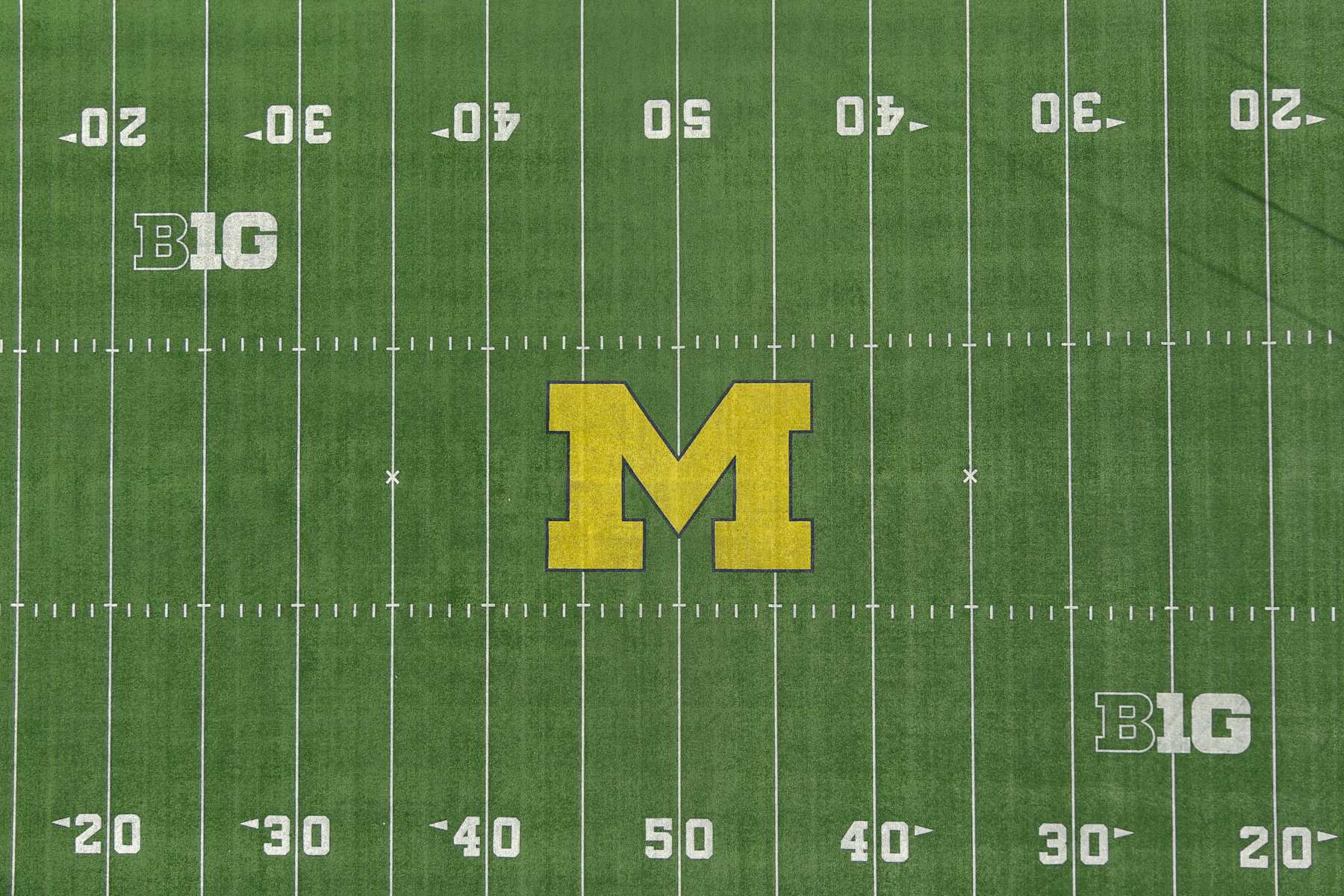 ANN ARBOR, MICHIGAN - DECEMBER 07: A general overall aerial view of the Michigan Wolverines and Big 10 Conference logos on the football field at Michigan Stadium on the University of Michigan campus, Thursday, Dec. 7, 2023, in Ann Arbor, Michigan. (Photo by Kirby Lee/Getty Images)