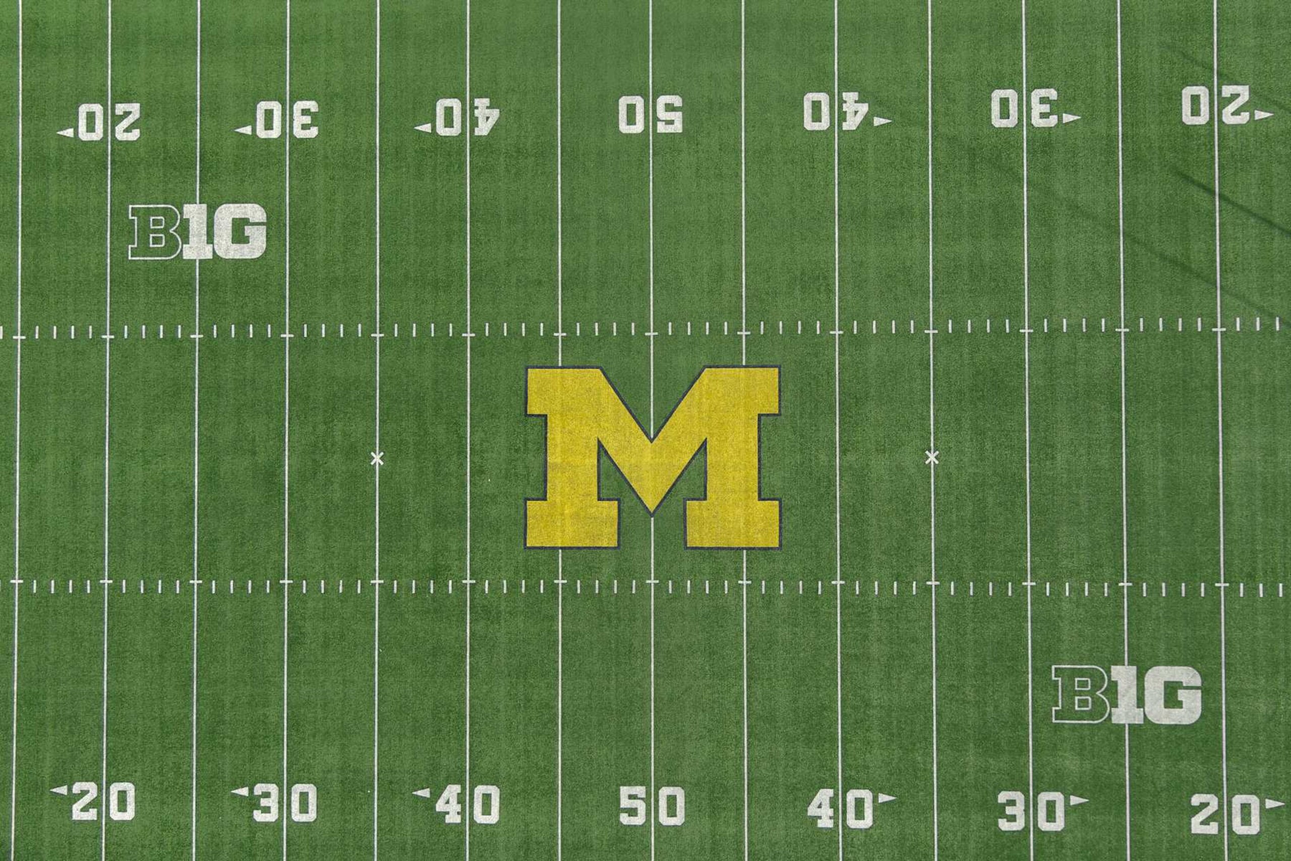 ANN ARBOR, MICHIGAN - DECEMBER 07: A general overall aerial view of the Michigan Wolverines and Big 10 Conference logos on the football field at Michigan Stadium on the University of Michigan campus, Thursday, Dec. 7, 2023, in Ann Arbor, Michigan. (Photo by Kirby Lee/Getty Images) ANN ARBOR, MICHIGAN - DECEMBER 07: A general overall aerial view of the Michigan Wolverines and Big 10 Conference logos on the football field at Michigan Stadium on the University of Michigan campus, Thursday, Dec. 7, 2023, in Ann Arbor, Michigan. (Photo by Kirby Lee/Getty Images)