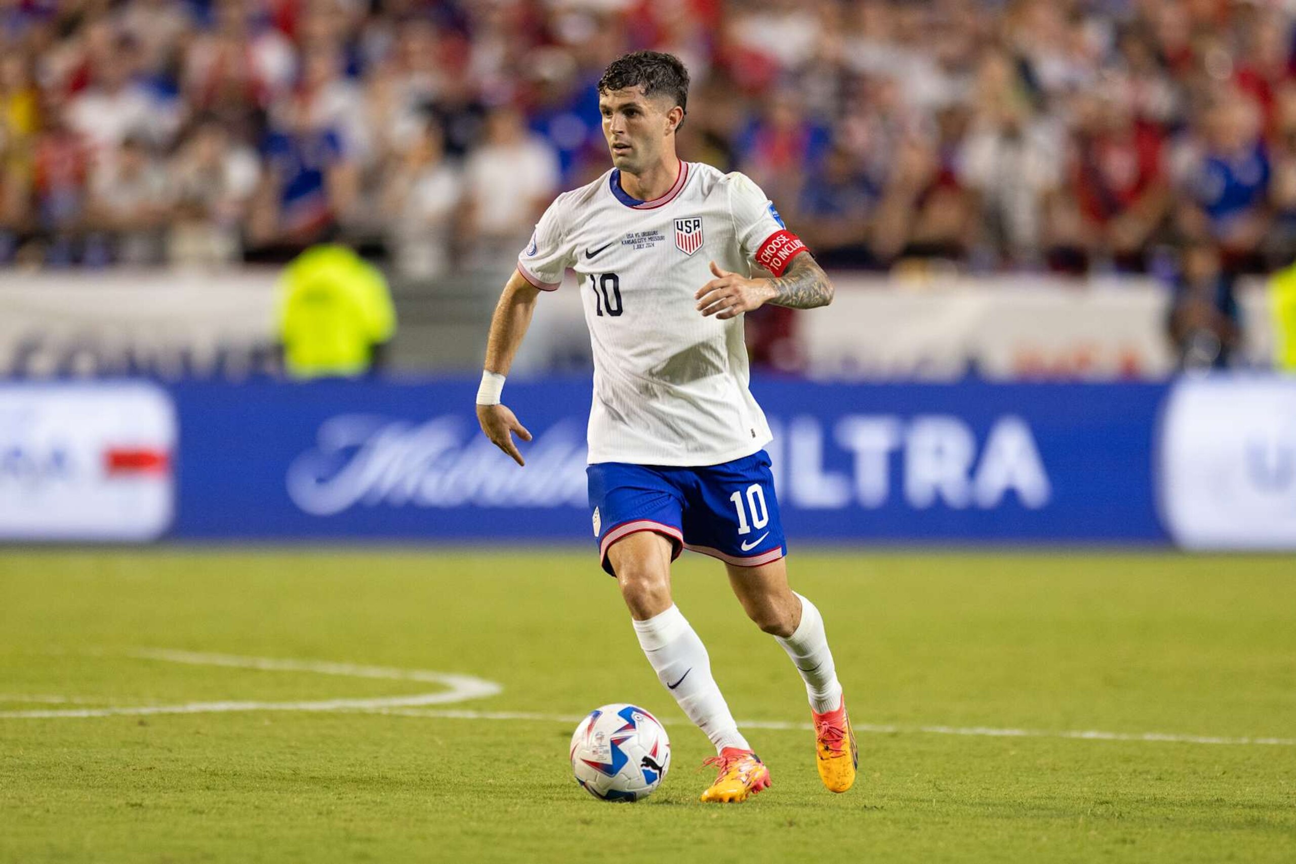 KANSAS, KS - JULY 1: Christian Pulisic #10 of the United States moves with the ballduring a game between Uruguay and USMNT atArrowhead Stadium on July 1, 2024 in Kansas , Kansas. (Photo by John Dorton/ISI Photos/USSF/Getty Images for USSF) KANSAS, KS - JULY 1: Christian Pulisic #10 of the United States moves with the ballduring a game between Uruguay and USMNT atArrowhead Stadium on July 1, 2024 in Kansas , Kansas. (Photo by John Dorton/ISI Photos/USSF/Getty Images for USSF)