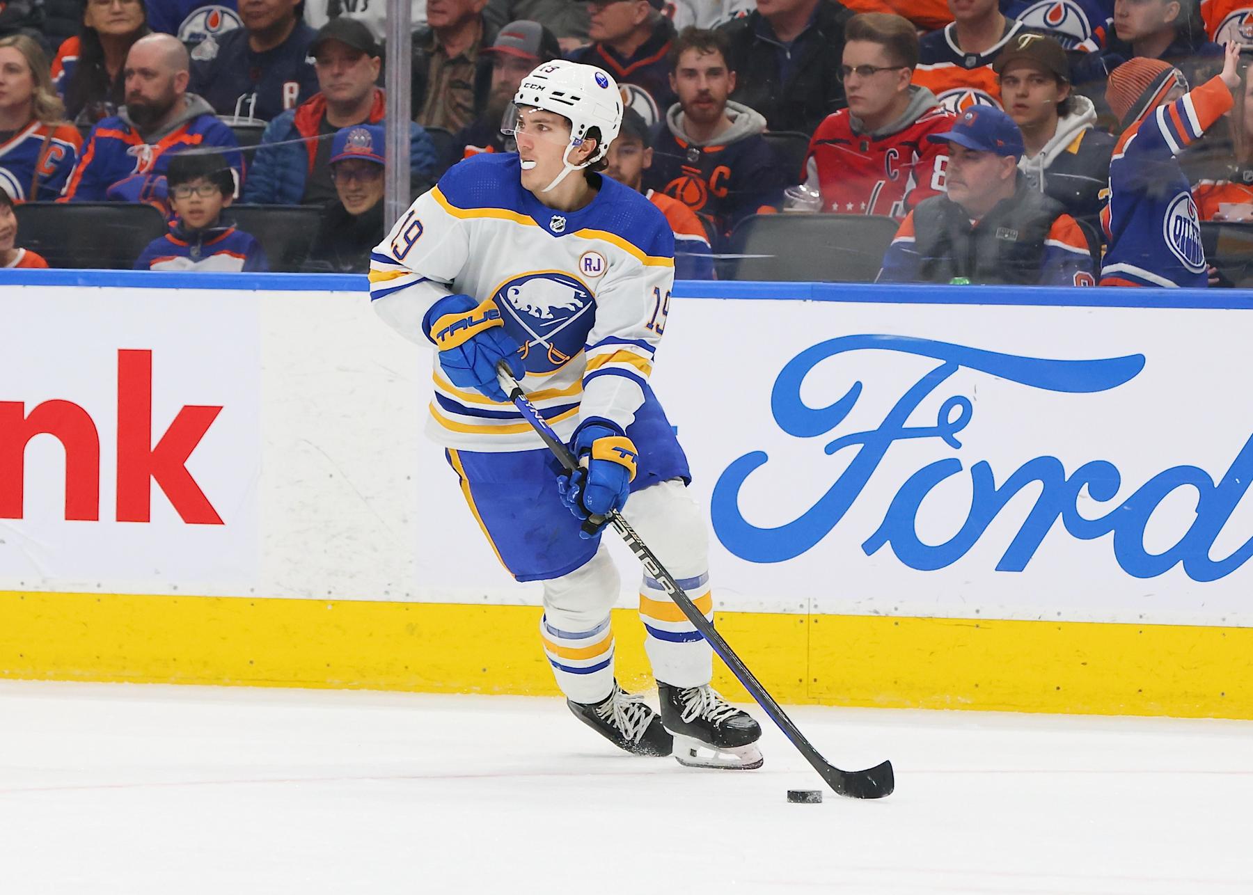 EDMONTON, CANADA - MARCH 21: Peyton Krebs #19 of the Buffalo Sabres skates with the puck in the second period against the Edmonton Oilers on March 21, 2024 at Rogers Place in Edmonton, Alberta, Canada. (Photo by Lawrence Scott/Getty Images)
