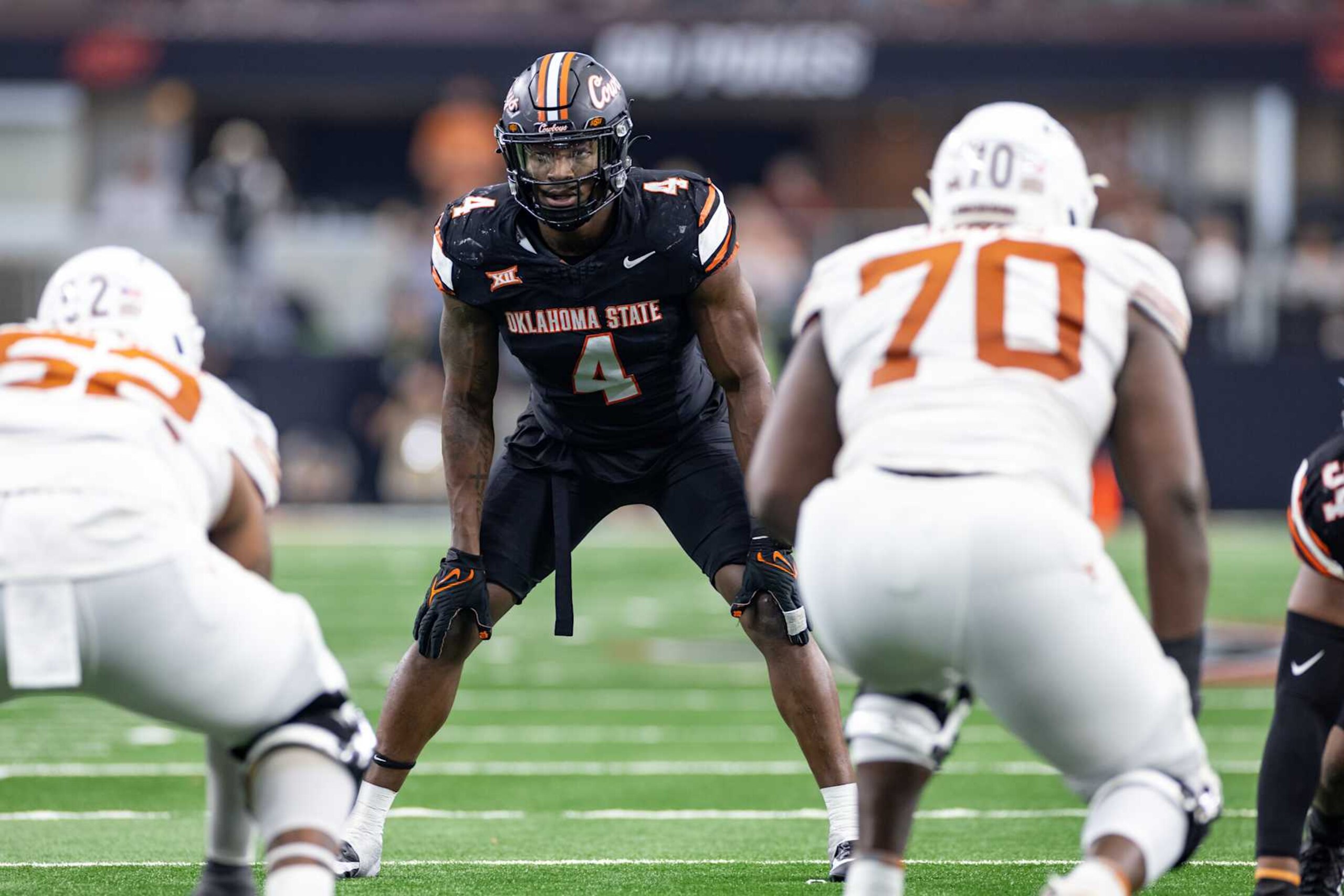 ARLINGTON, TX - DECEMBER 02: Oklahoma State Cowboys linebacker Nickolas Martin (#4) looks up field during the Big 12 Championship football game between the Texas Longhorns and Oklahoma State Cowboys on December 02, 2023 at AT&T Studium in Arlington, Texas. (Photo by Matthew Visinsky/Icon Sportswire via Getty Images) ARLINGTON, TX - DECEMBER 02: Oklahoma State Cowboys linebacker Nickolas Martin (#4) looks up field during the Big 12 Championship football game between the Texas Longhorns and Oklahoma State Cowboys on December 02, 2023 at AT&T Studium in Arlington, Texas. (Photo by Matthew Visinsky/Icon Sportswire via Getty Images)