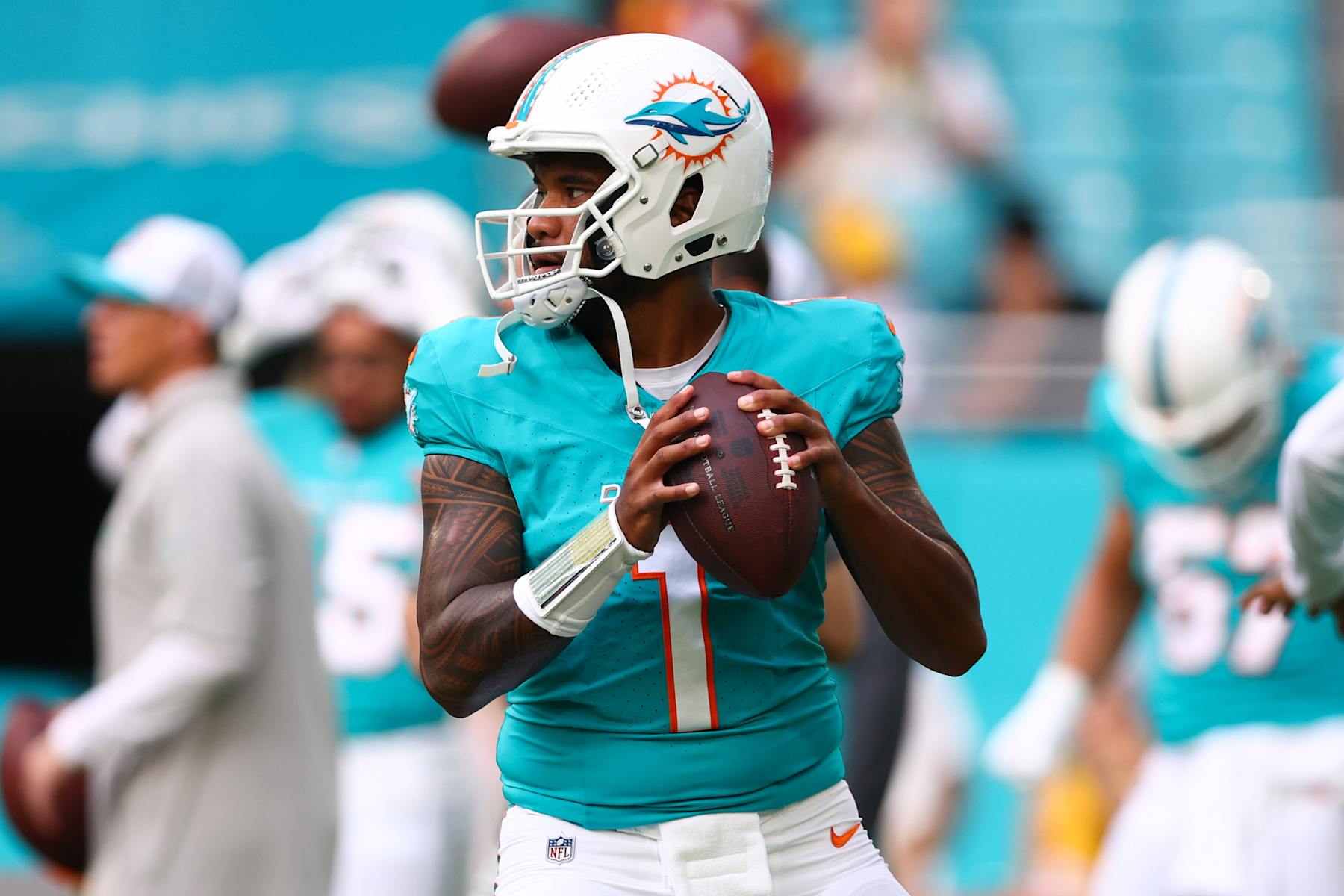MIAMI GARDENS, FLORIDA - AUGUST 17: Tua Tagovailoa #1 of the Miami Dolphins warms up prior to a a preseason game against the Washington Commanders at Hard Rock Stadium on August 17, 2024 in Miami Gardens, Florida. (Photo by Megan Briggs/Getty Images)