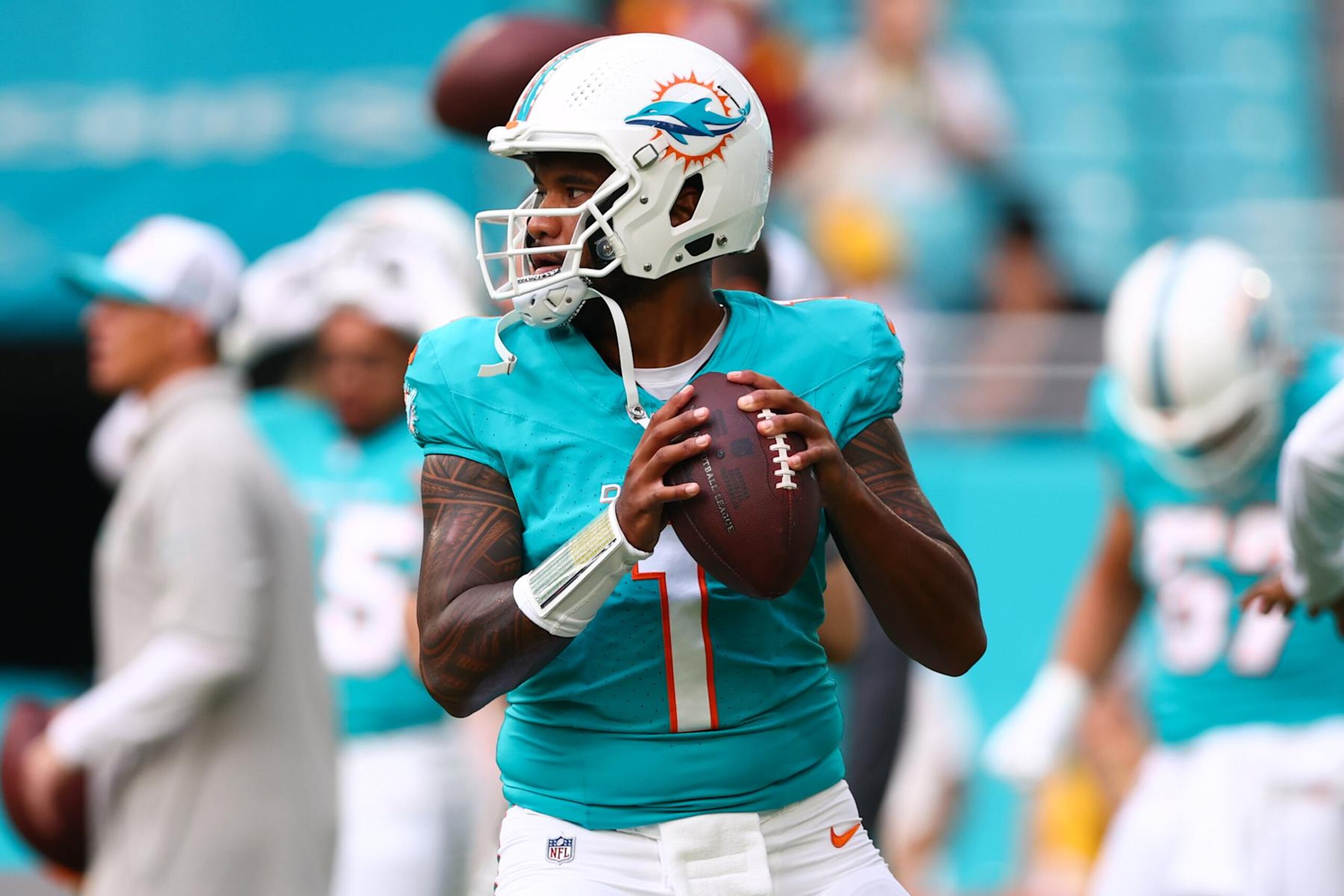 MIAMI GARDENS, FLORIDA - AUGUST 17: Tua Tagovailoa #1 of the Miami Dolphins warms up prior to a a preseason game against the Washington Commanders at Hard Rock Stadium on August 17, 2024 in Miami Gardens, Florida. (Photo by Megan Briggs/Getty Images)