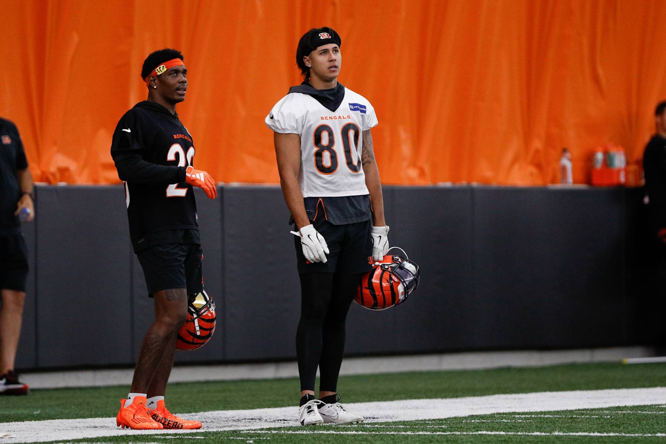 CINCINNATI, OH - JUNE 13: Cincinnati Bengals cornerback Cam Taylor-Britt (29) stands with wide receiver Andrei Iosivas (80) during the Cincinnati Bengals minicamp at the IEL Indoor Facility on June 13, 2024 in Cincinnati, Ohio. (Photo by Ian Johnson/Icon Sportswire via Getty Images)