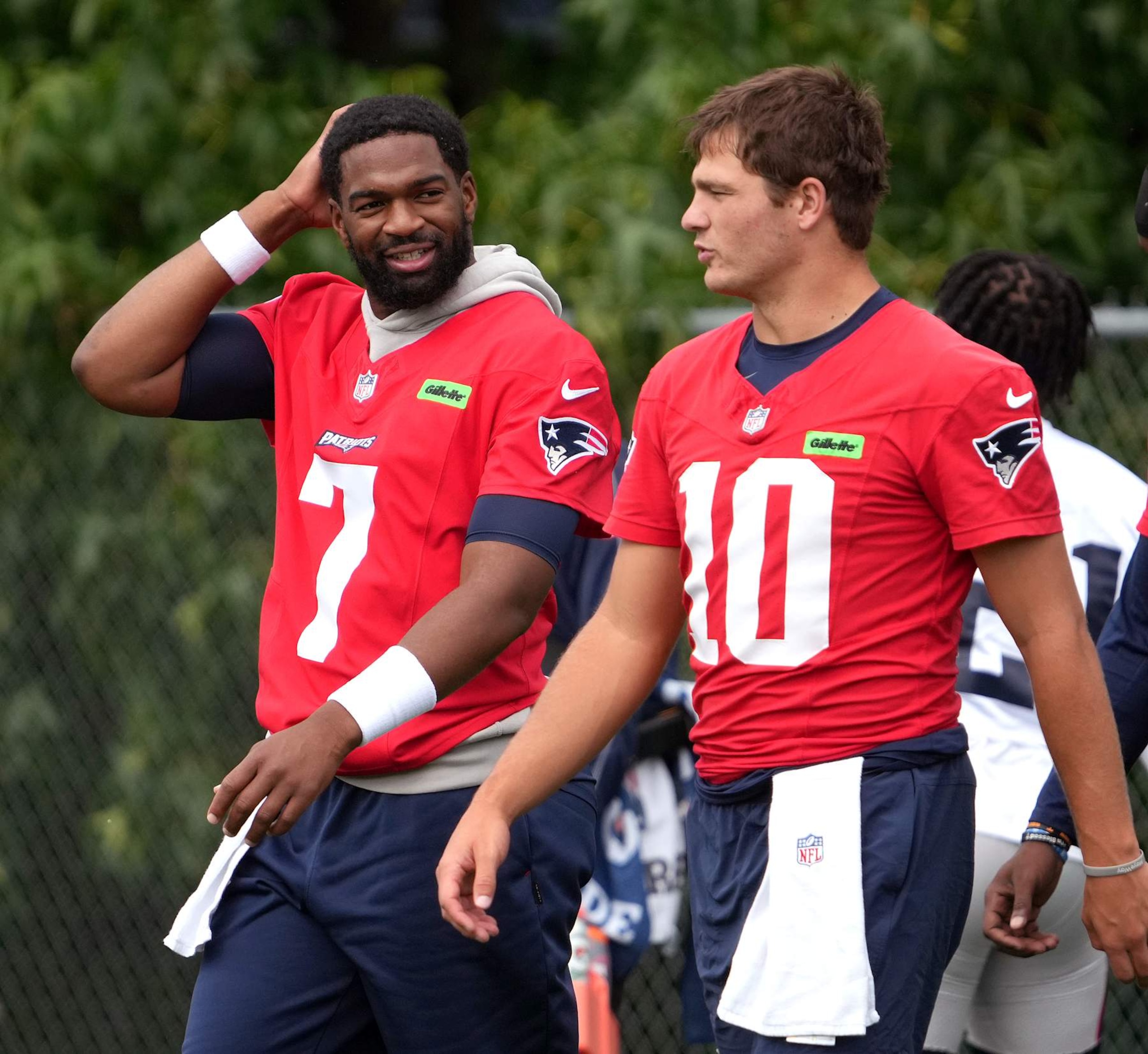 Foxborough, MA - August 29: New England Patriots QBs Jacoby Brissett and Drake Maye. (Photo by Barry Chin/The Boston Globe via Getty Images) Foxborough, MA - August 29: New England Patriots QBs Jacoby Brissett and Drake Maye. (Photo by Barry Chin/The Boston Globe via Getty Images)