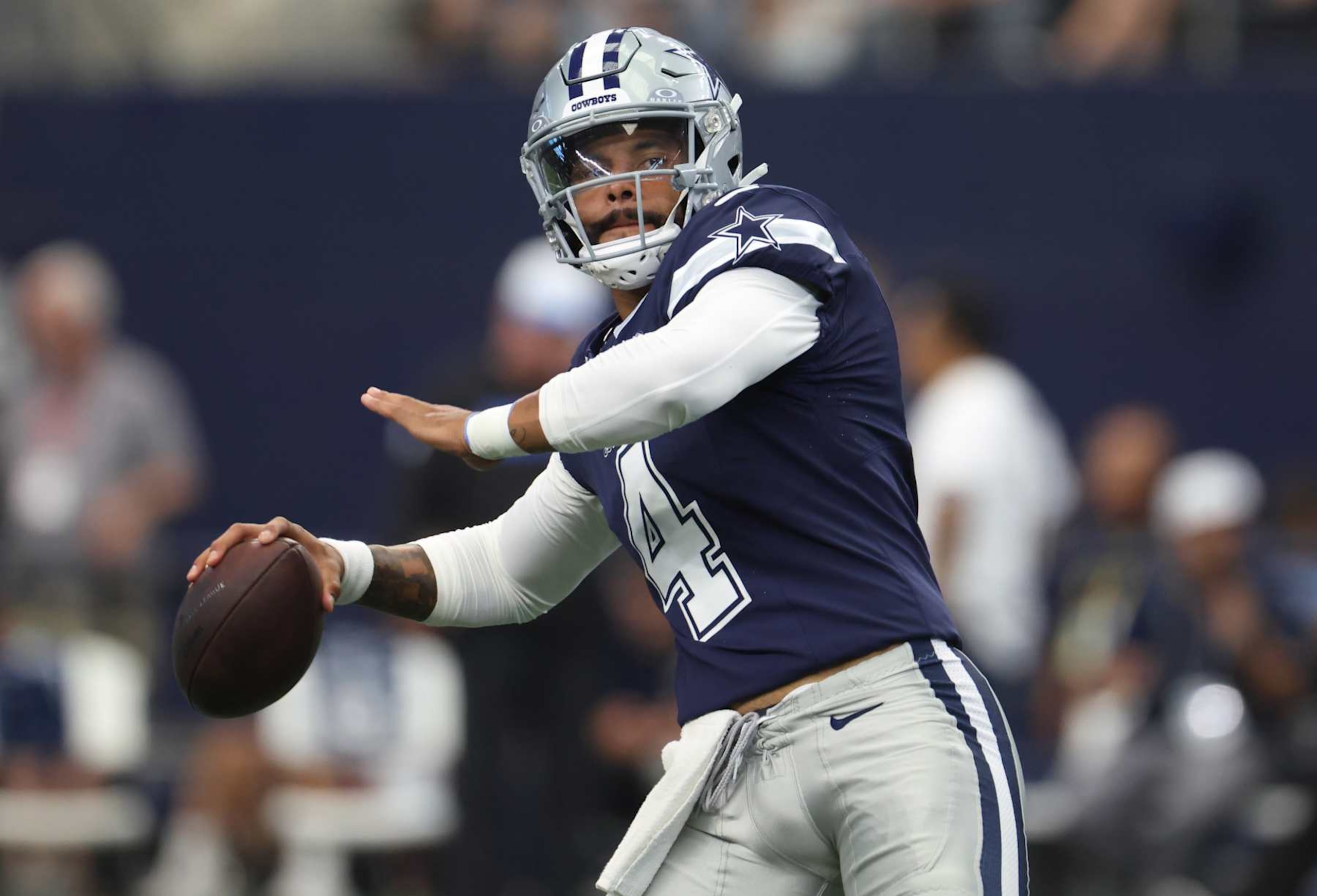 ARLINGTON, TX - AUGUST 24: Dak Prescott #4 of the Dallas Cowboys warms up before a preseason game between the Dallas Cowboys and the Los Angeles Chargers at AT&T Stadium on August 24, 2024 in Arlington, Texas. (Photo by Ron Jenkins/Getty Images) ARLINGTON, TX - AUGUST 24: Dak Prescott #4 of the Dallas Cowboys warms up before a preseason game between the Dallas Cowboys and the Los Angeles Chargers at AT&T Stadium on August 24, 2024 in Arlington, Texas. (Photo by Ron Jenkins/Getty Images)