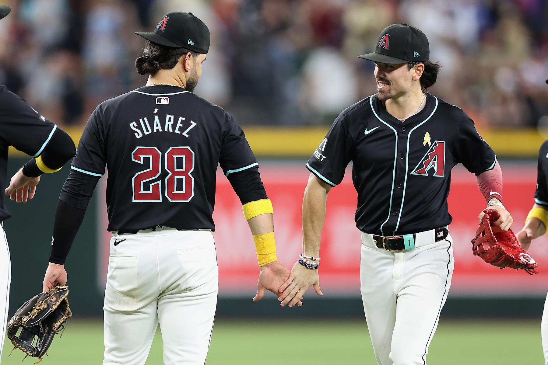Eugenio Suárez (L) and Corbin Carroll (R)