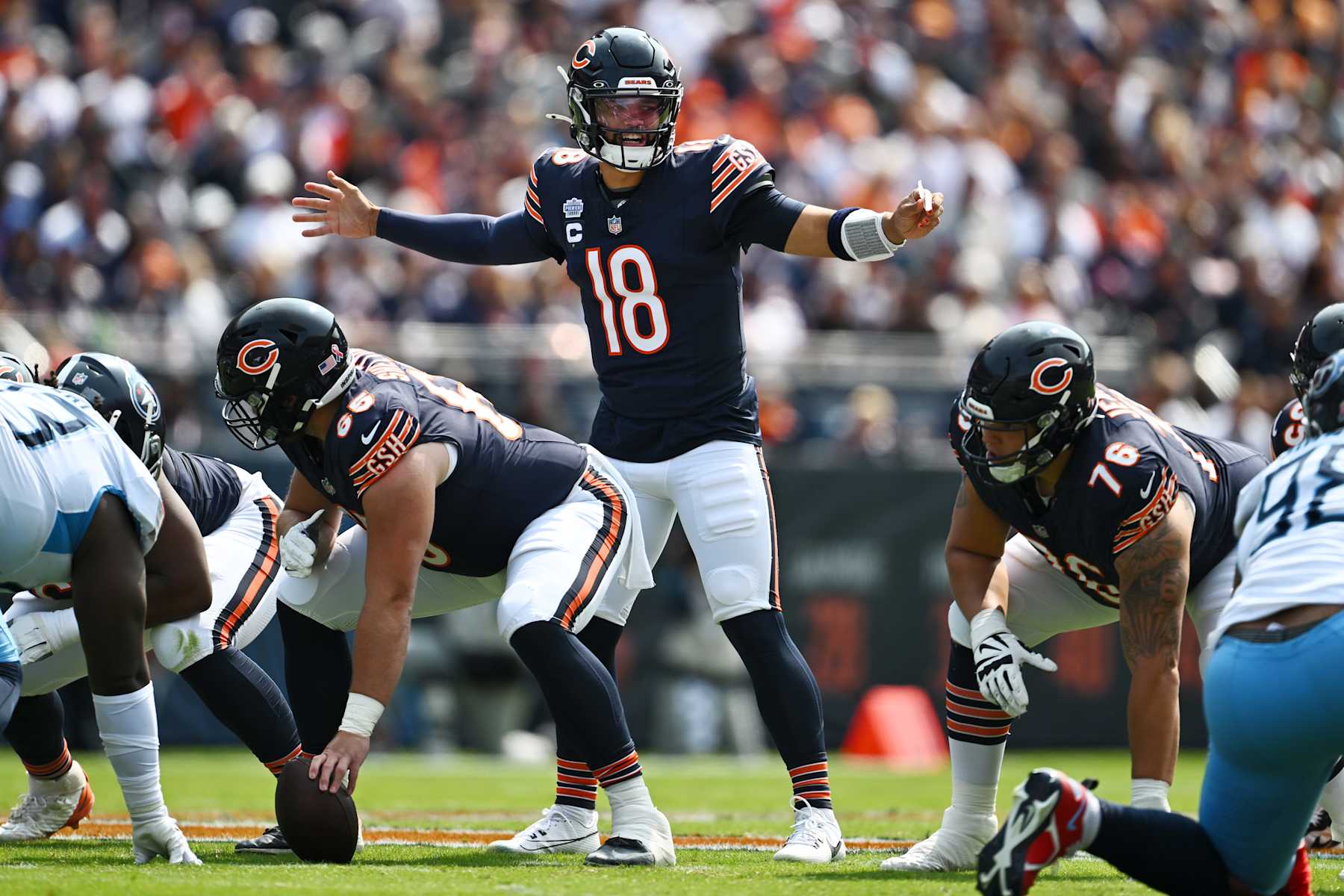 CHICAGO, ILLINOIS - SEPTEMBER 08: Caleb Williams #18 of the Chicago Bears gestures at the line of scrimmage in the first quarter of the game against the Tennessee Titans at Soldier Field on September 08, 2024 in Chicago, Illinois. (Photo by Quinn Harris/Getty Images)