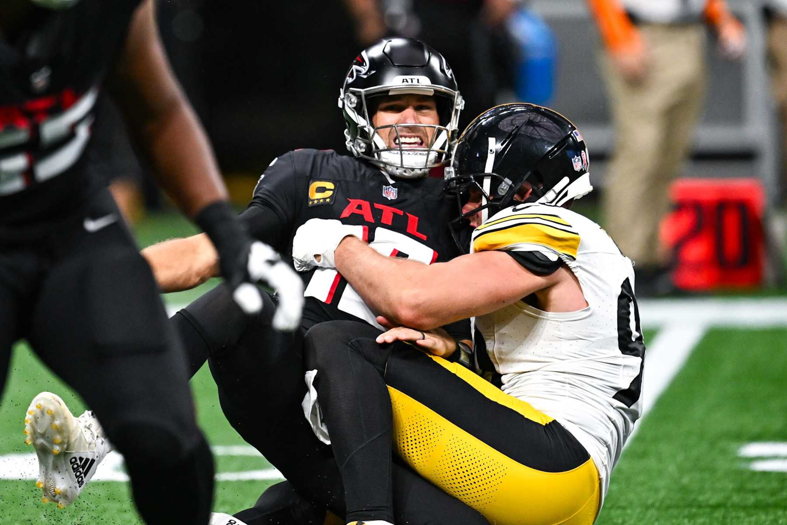 ATLANTA, GA  SEPTEMBER 08:  Pittsburgh linebacker T.J. Watt (90) hits Atlanta quarterback Kirk Cousins (18) during the NFL game between the Pittsburgh Steelers and the Atlanta Falcons on September 8th, 2024 at Mercedes-Benz Stadium in Atlanta, GA.  (Photo by Rich von Biberstein/Icon Sportswire via Getty Images)