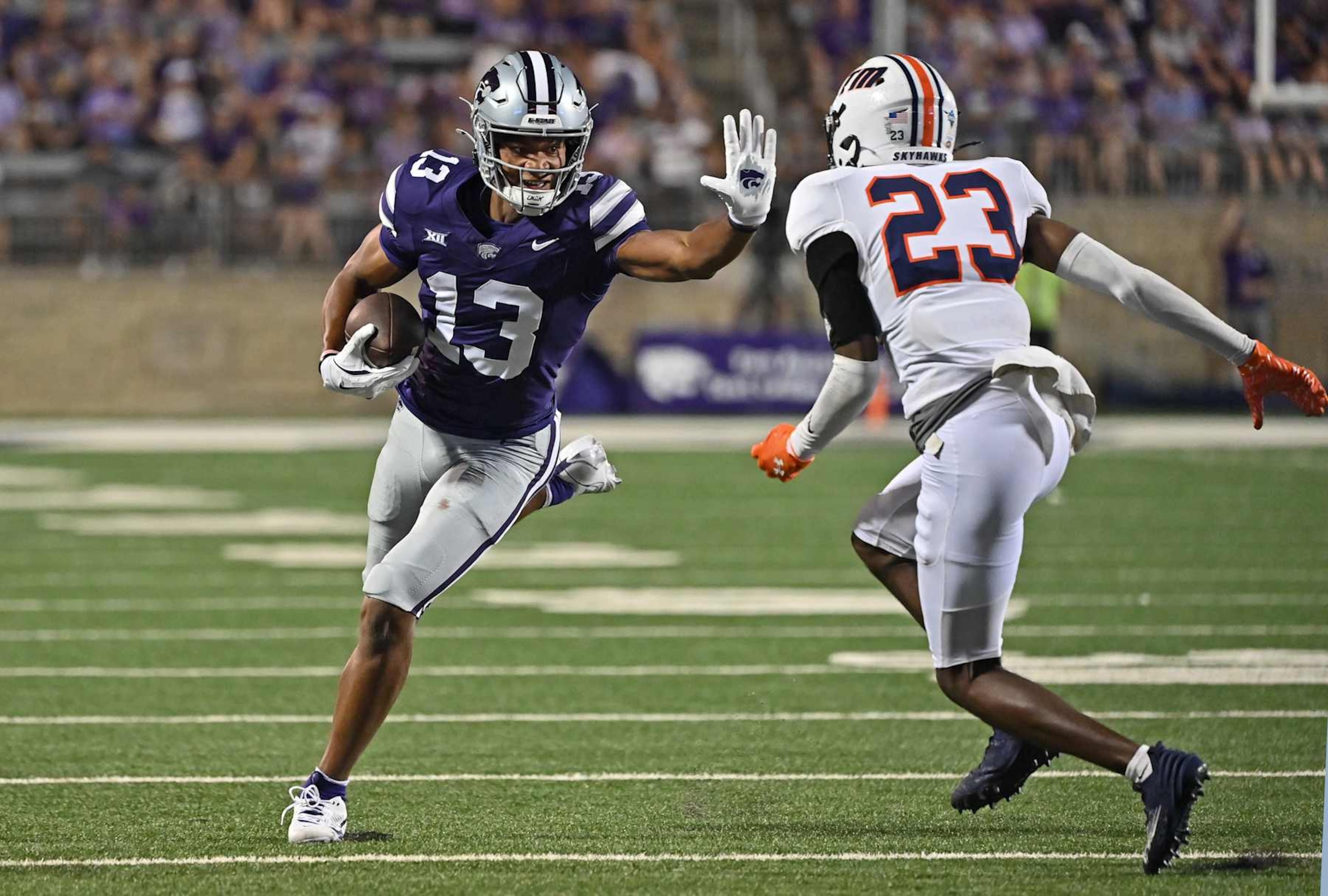 MANHATTAN, KS - AUGUST 31:  Wide receiver Andre Davis #13 of the Kansas State Wildcats runs up field after catching a pass against cornerback Celeycan Hill #23 of the Tennessee Martin Skyhawks, in the second half at Bill Snyder Family Football Stadium on August 31, 2024 in Manhattan, Kansas. (Photo by Peter G. Aiken/Getty Images)
