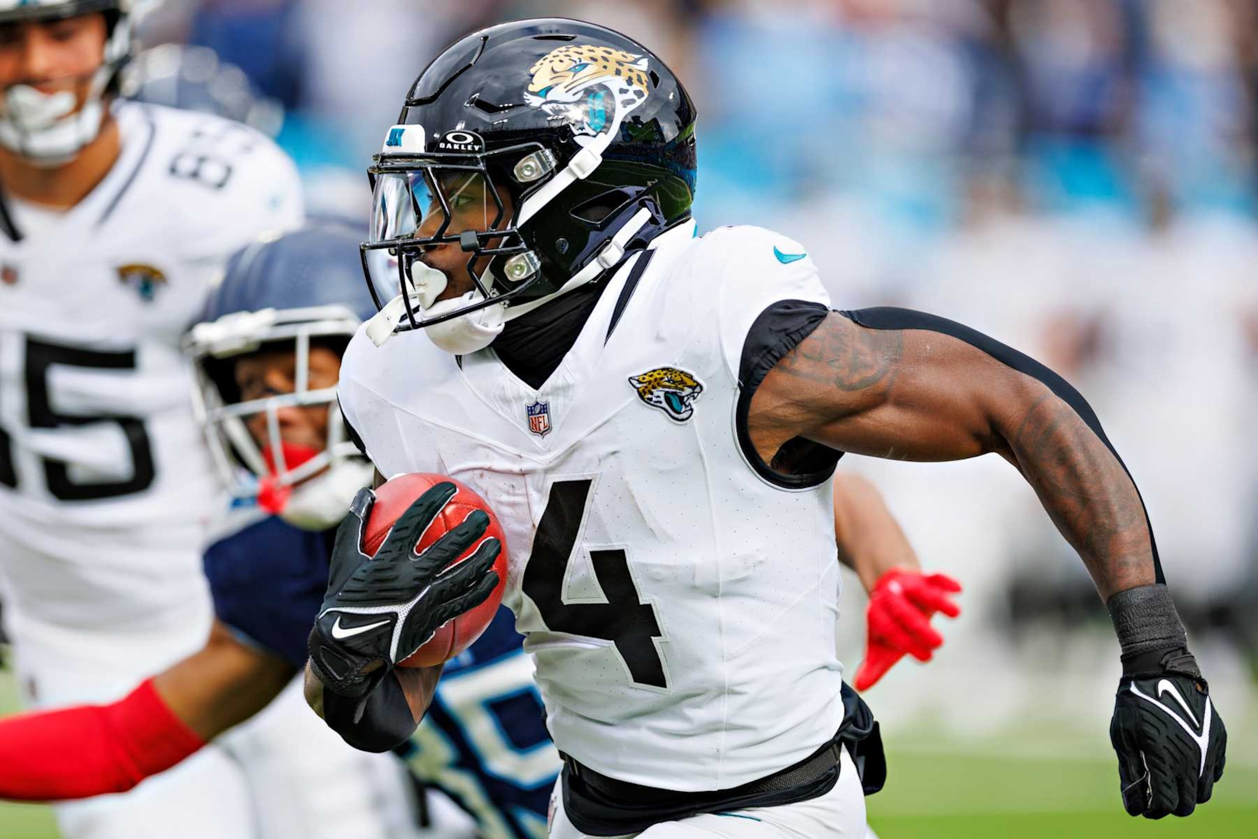NASHVILLE TENNESSEE - JANUARY 07: Tank Bigsby #4 of the Jacksonville Jaguars returns a kick off during the game against the Tennessee Titans in Nashville, Tennessee at Nissan Stadium on January 7, 2024 in Houston, Texas. The Titans defeated the Jaguars 28-20.  (Photo by Wesley Hitt/Getty Images)