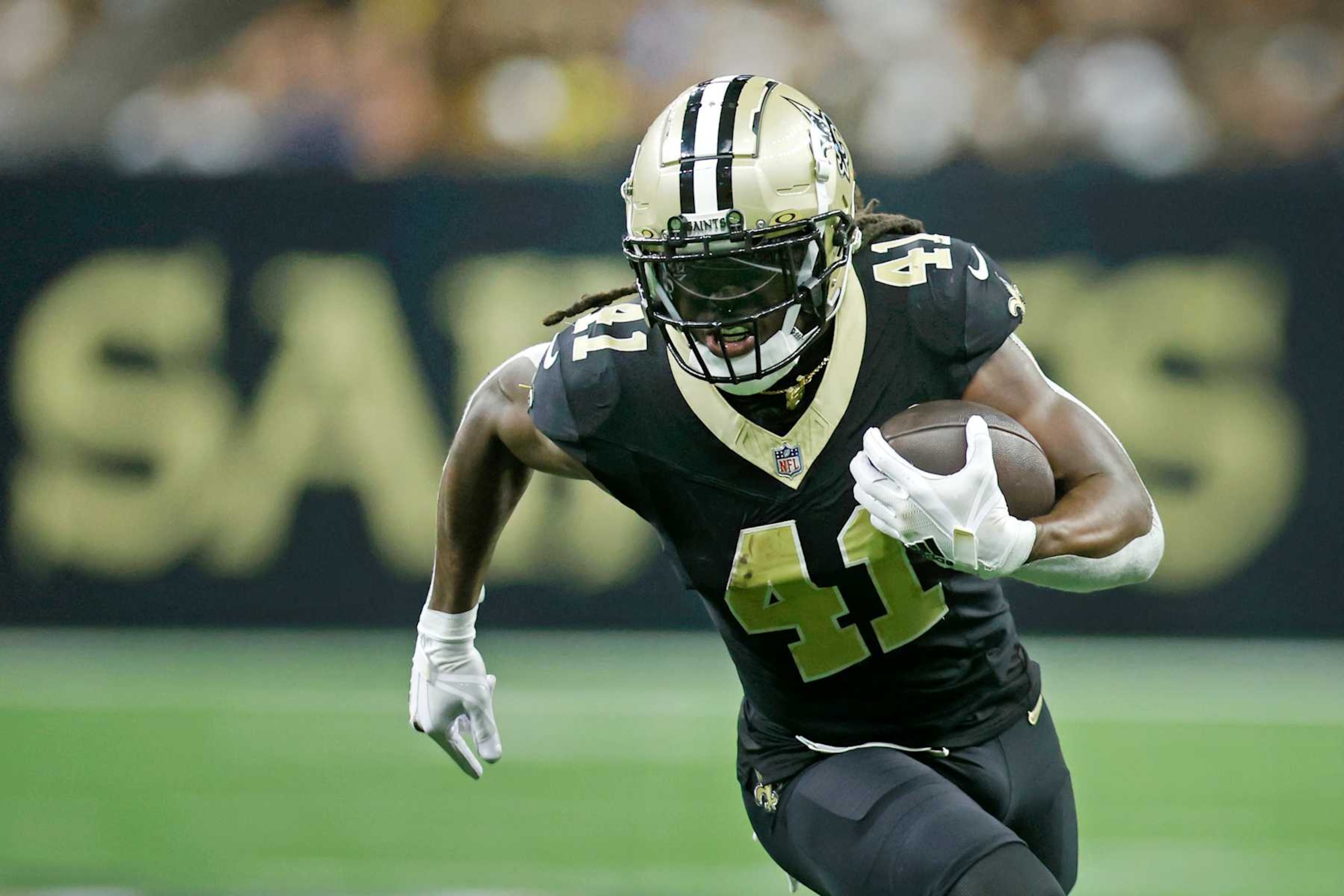 NEW ORLEANS, LOUISIANA - SEPTEMBER 08: Alvin Kamara #41 of the New Orleans Saints runs the ball during the first quarter against the Carolina Panthers at Caesars Superdome on September 08, 2024 in New Orleans, Louisiana. (Photo by Chris Graythen/Getty Images)