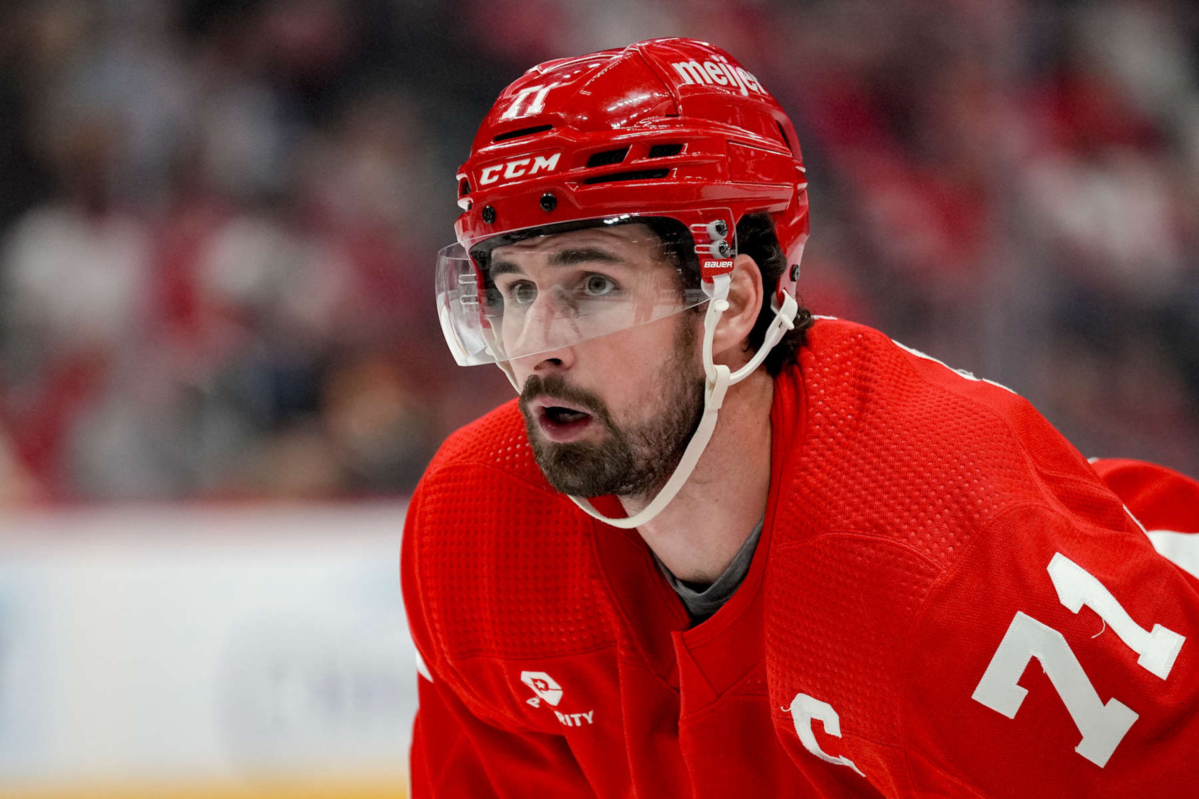 DETROIT, MICHIGAN - APRIL 09: Dylan Larkin #71 of the Detroit Red Wings looks on against the Washington Capitals at Little Caesars Arena on April 09, 2024 in Detroit, Michigan. (Photo by Nic Antaya/Getty Images)