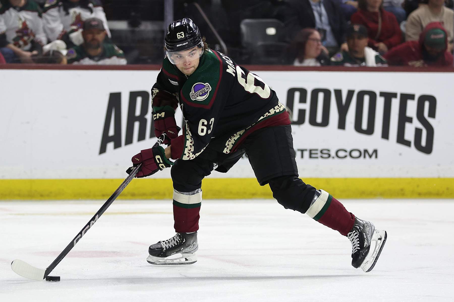 TEMPE, ARIZONA - APRIL 17: Matias Maccelli #63 of the Arizona Coyotes skates with the puck during the NHL game at Mullett Arena on April 17, 2024 in Tempe, Arizona. The Coyotes defeated the Oilers 5-2.  (Photo by Christian Petersen/Getty Images)