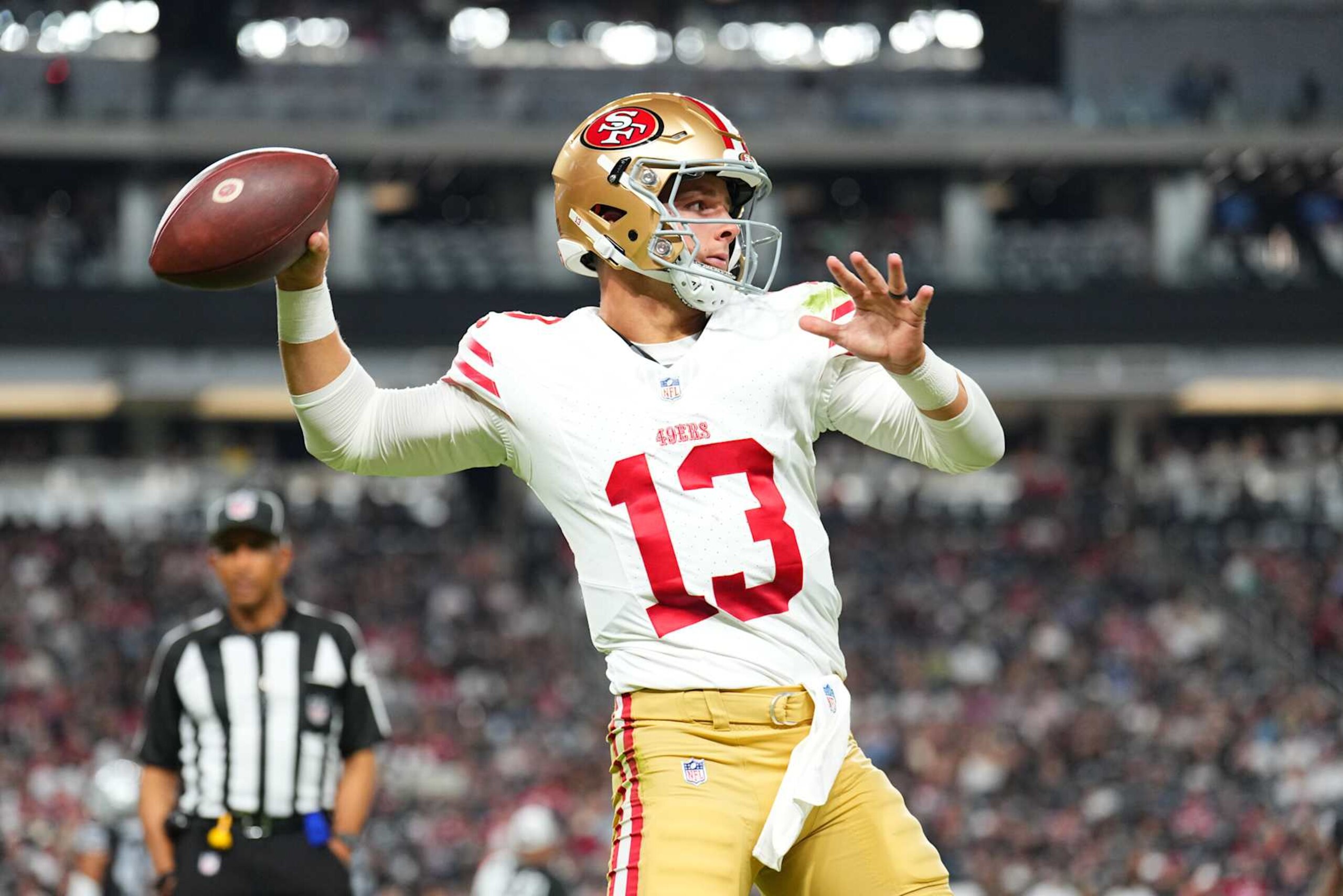 LAS VEGAS, NEVADA - AUGUST 23: Quarterback Brock Purdy #13 of the San Francisco 49ers warms up on the sideline in the first half of a preseason game against the Las Vegas Raiders at Allegiant Stadium on August 23, 2024 in Las Vegas, Nevada. (Photo by Chris Unger/Getty Images)