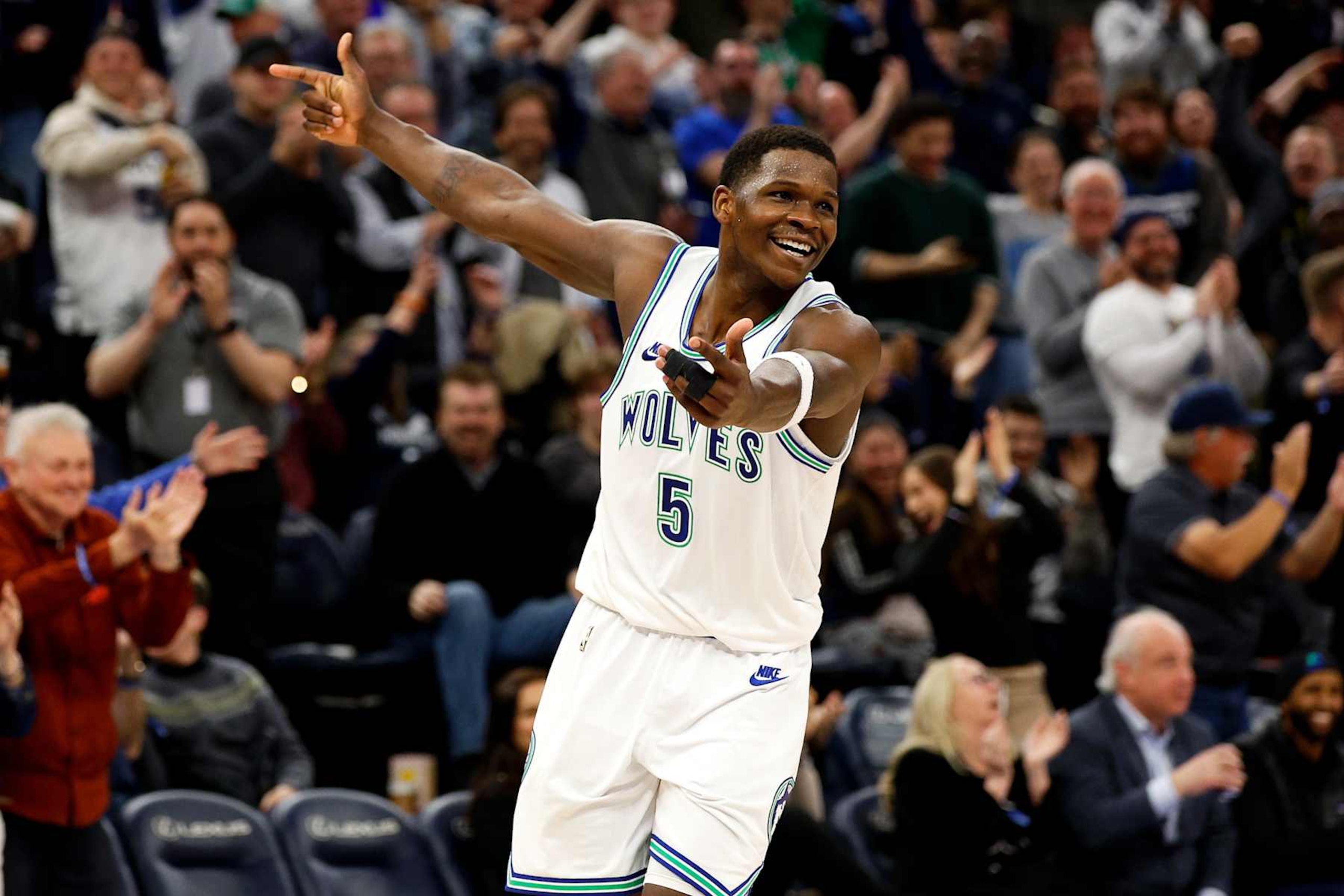 MINNEAPOLIS, MINNESOTA - MARCH 19: Anthony Edwards #5 of the Minnesota Timberwolves celebrates against the Denver Nuggets in the third quarter at Target Center on March 19, 2024 in Minneapolis, Minnesota. The Nuggets defeated the Timberwolves 115-112. NOTE TO USER: User expressly acknowledges and agrees that, by downloading and or using this photograph, User is consenting to the terms and conditions of the Getty Images License Agreement. (Photo by David Berding/Getty Images) MINNEAPOLIS, MINNESOTA - MARCH 19: Anthony Edwards #5 of the Minnesota Timberwolves celebrates against the Denver Nuggets in the third quarter at Target Center on March 19, 2024 in Minneapolis, Minnesota. The Nuggets defeated the Timberwolves 115-112. NOTE TO USER: User expressly acknowledges and agrees that, by downloading and or using this photograph, User is consenting to the terms and conditions of the Getty Images License Agreement. (Photo by David Berding/Getty Images)