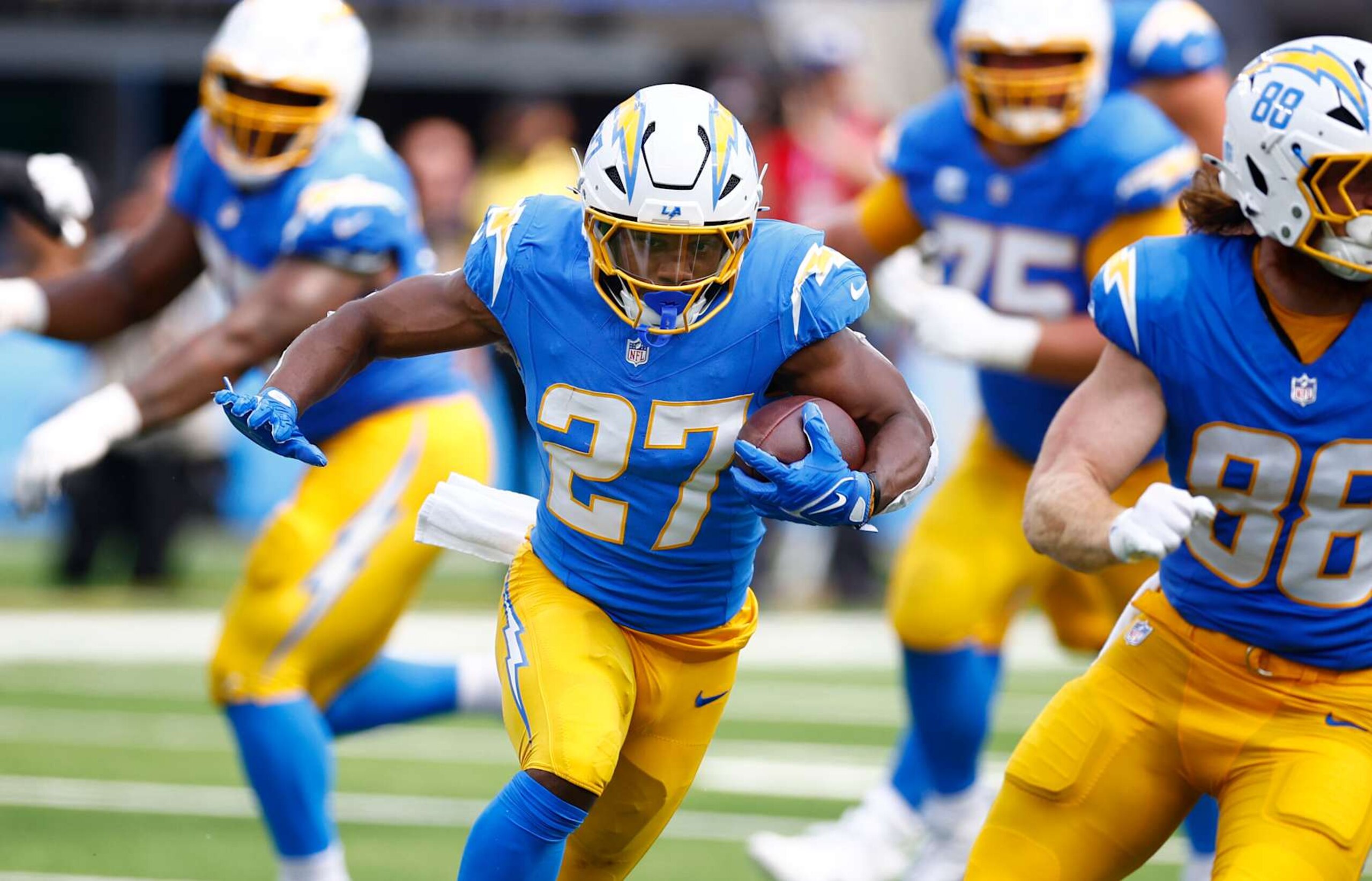 INGLEWOOD, CALIFORNIA - SEPTEMBER 08: J.K. Dobbins #27 of the Los Angeles Chargers runs the ball during the third quarter against the Las Vegas Raiders at SoFi Stadium on September 08, 2024 in Inglewood, California. (Photo by Ronald Martinez/Getty Images)