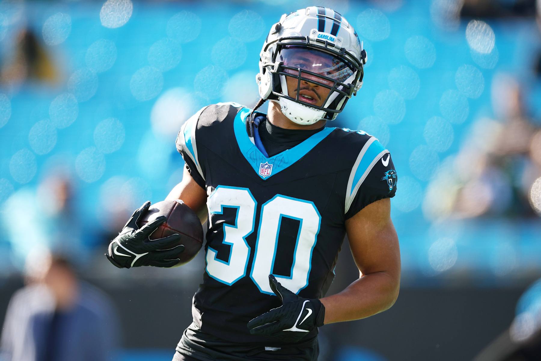 CHARLOTTE, NORTH CAROLINA - DECEMBER 24: Chuba Hubbard #30 of the Carolina Panthers warms up before the game against the Green Bay Packers at Bank of America Stadium on December 24, 2023 in Charlotte, North Carolina. (Photo by Jared C. Tilton/Getty Images)