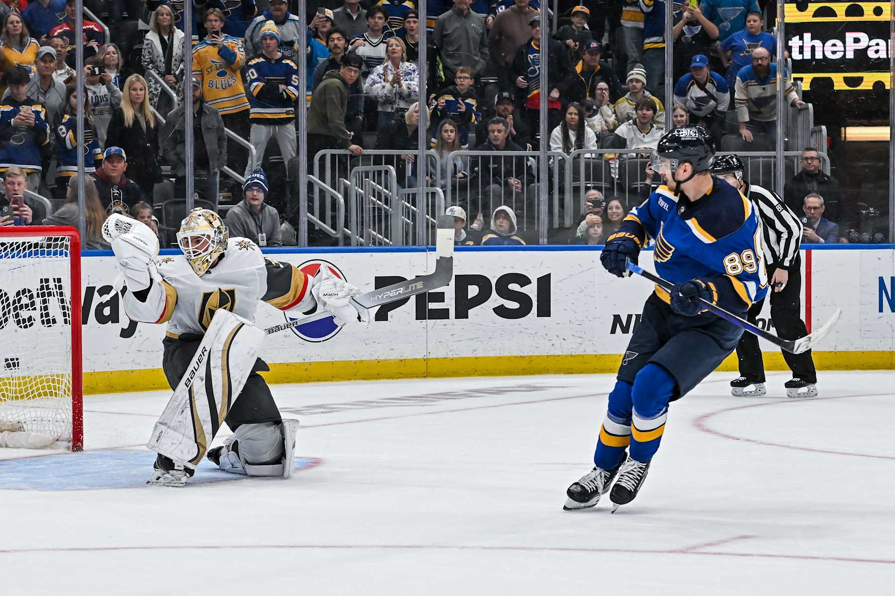 ST. LOUIS, MO - March 25: Vegas Golden Knights goaltender Logan Thompson (36) makes a glove save on the penalty shot by St. Louis Blues left wing Pavel Buchnevich (89) in overtime during a regular season game between the Vegas Golden Knights and the St. Louis Blues on March 25, 2024, at the Enterprise Center in St. Louis MO (Photo by Rick Ulreich/Icon Sportswire via Getty Images)