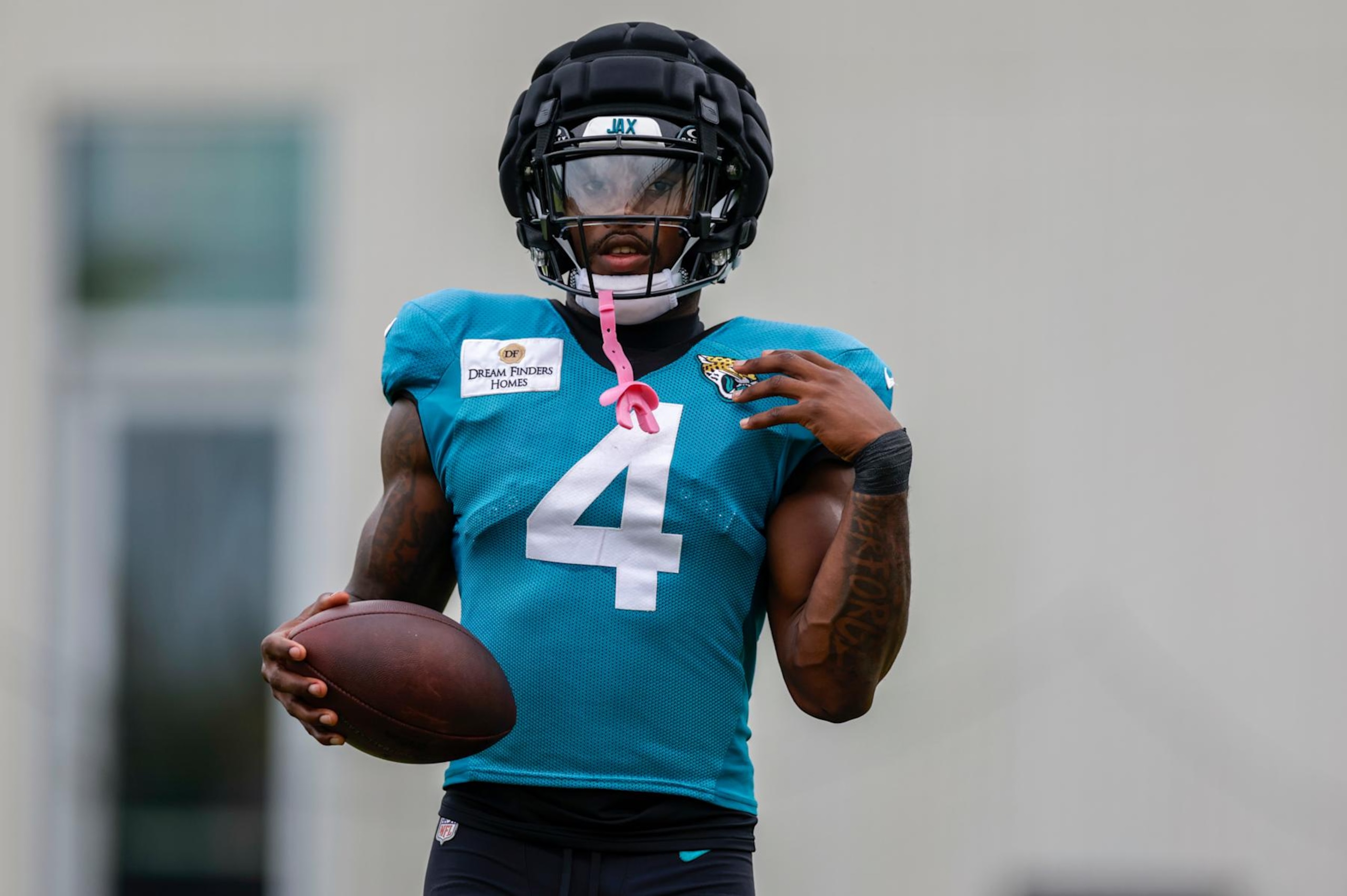 JACKSONVILLE, FL - JULY 30: Jacksonville Jaguars running back Tank Bigsby (4) looks on during the Jacksonville Jaguars Training Camp on July 30, 2024 at Miller Electric Center in Jacksonville, Fl. (Photo by David Rosenblum/Icon Sportswire via Getty Images)