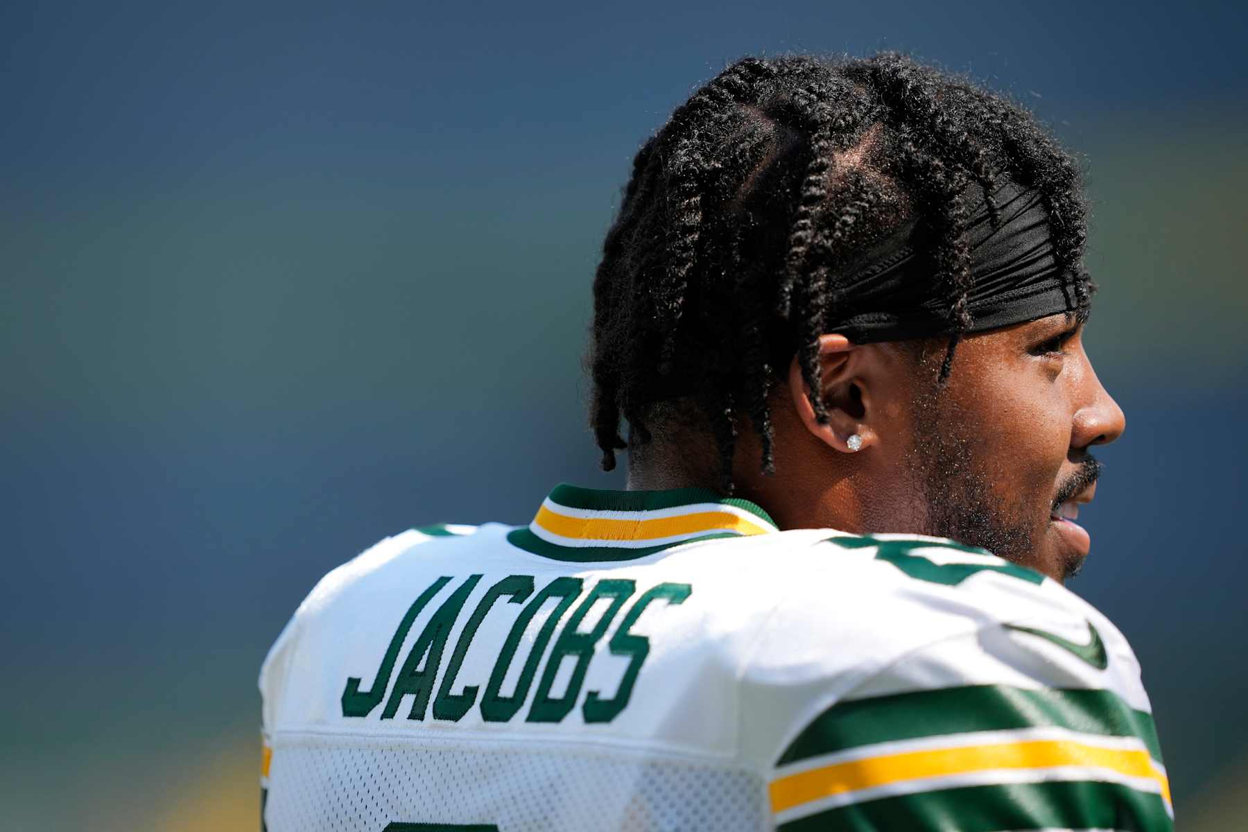 GREEN BAY, WISCONSIN - AUGUST 24: Josh Jacobs #8 of the Green Bay Packers warms up before a preseason game against the Baltimore Ravens at Lambeau Field on August 24, 2024 in Green Bay, Wisconsin. (Photo by Patrick McDermott/Getty Images)