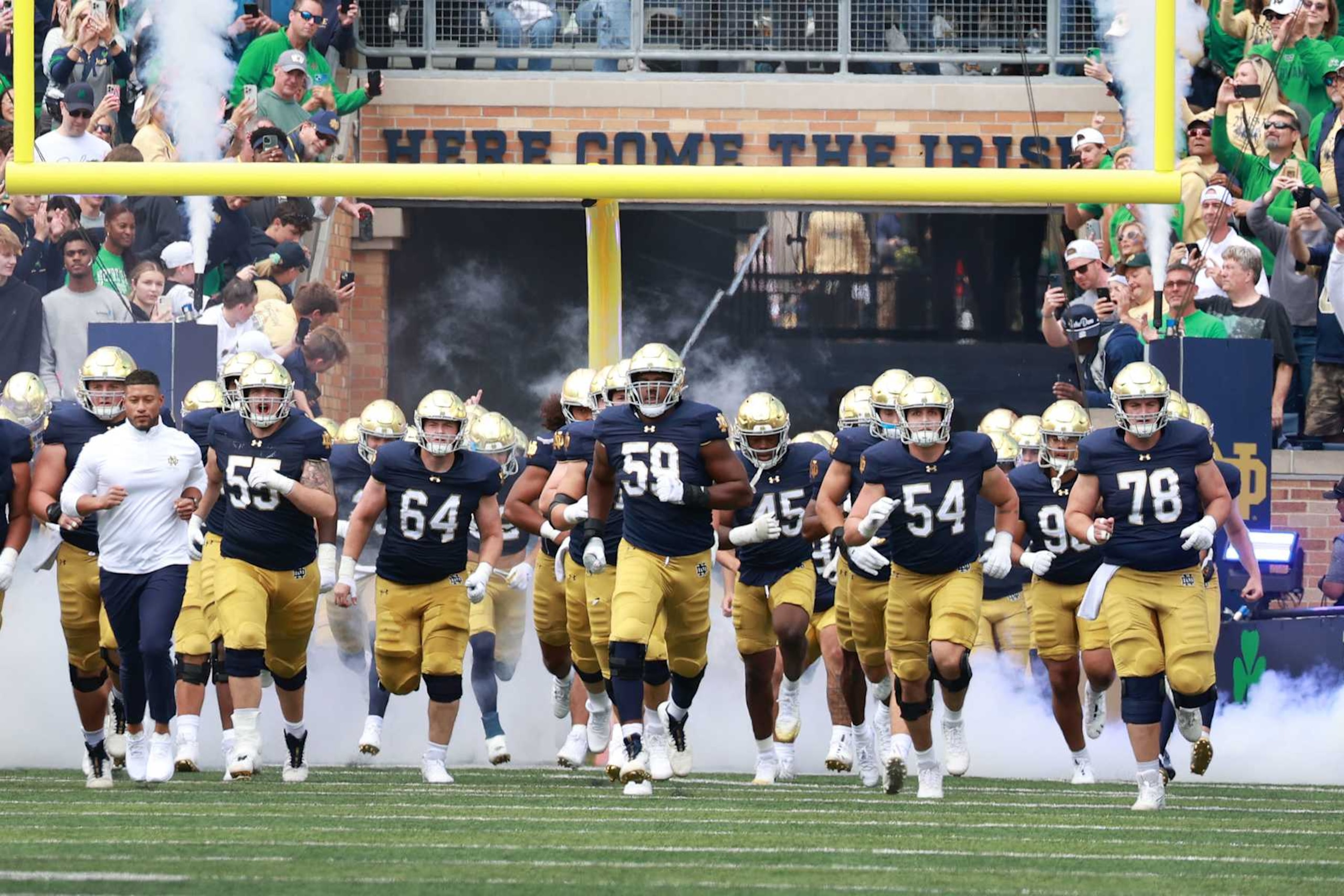 SOUTH BEND, IN - SEPTEMBER 07: Notre Dame Fighting Irish coach Marcus Freeman leads the team onto the field before the game against the Northern Illinois Huskiers on September 7, 2024, at Notre Dame Stadium in South Bend, Indiana. (Photo by Brian Spurlock/Icon Sportswire via Getty Images) SOUTH BEND, IN - SEPTEMBER 07: Notre Dame Fighting Irish coach Marcus Freeman leads the team onto the field before the game against the Northern Illinois Huskiers on September 7, 2024, at Notre Dame Stadium in South Bend, Indiana. (Photo by Brian Spurlock/Icon Sportswire via Getty Images)